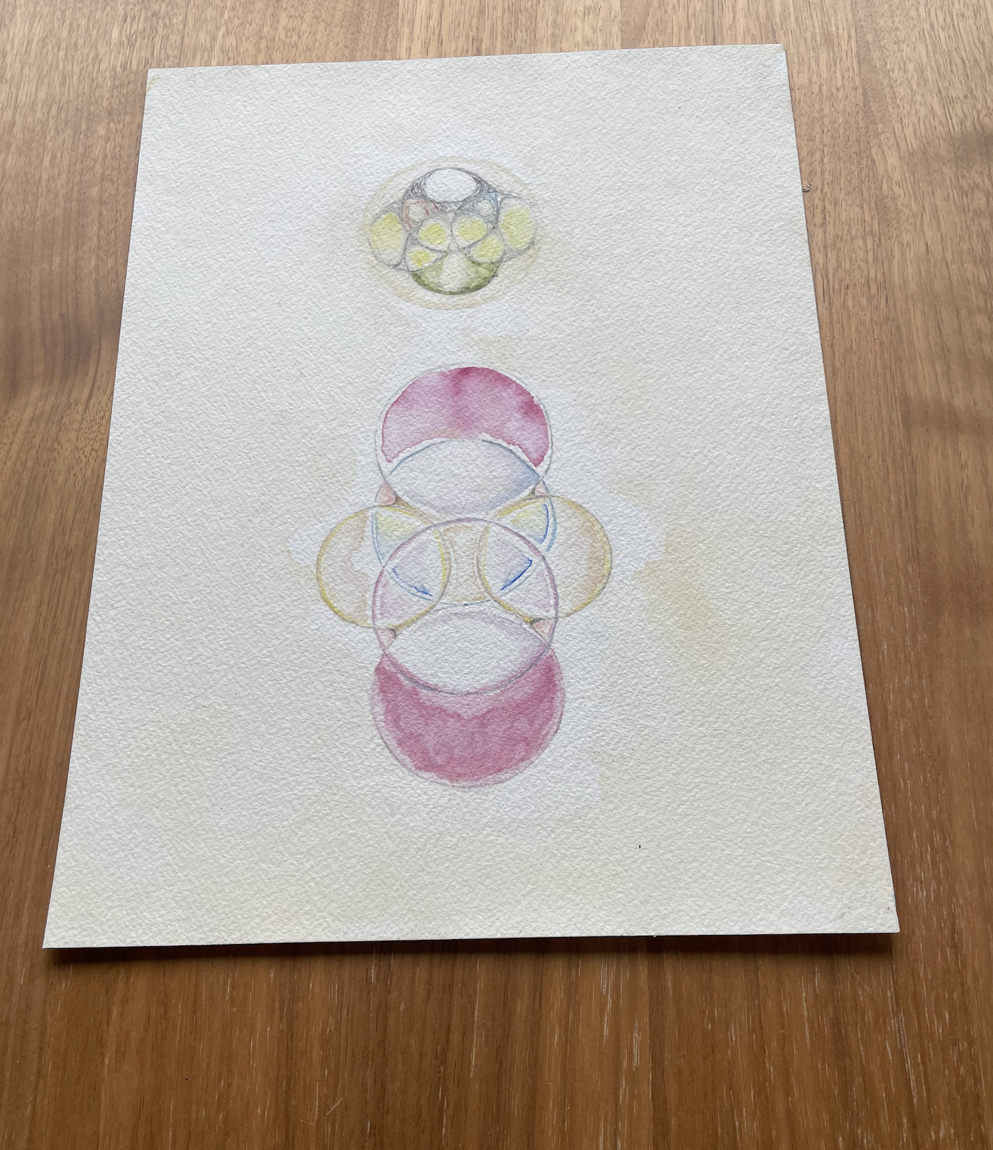 Circles forming geometric symbols that create meaning. It is in water color. 