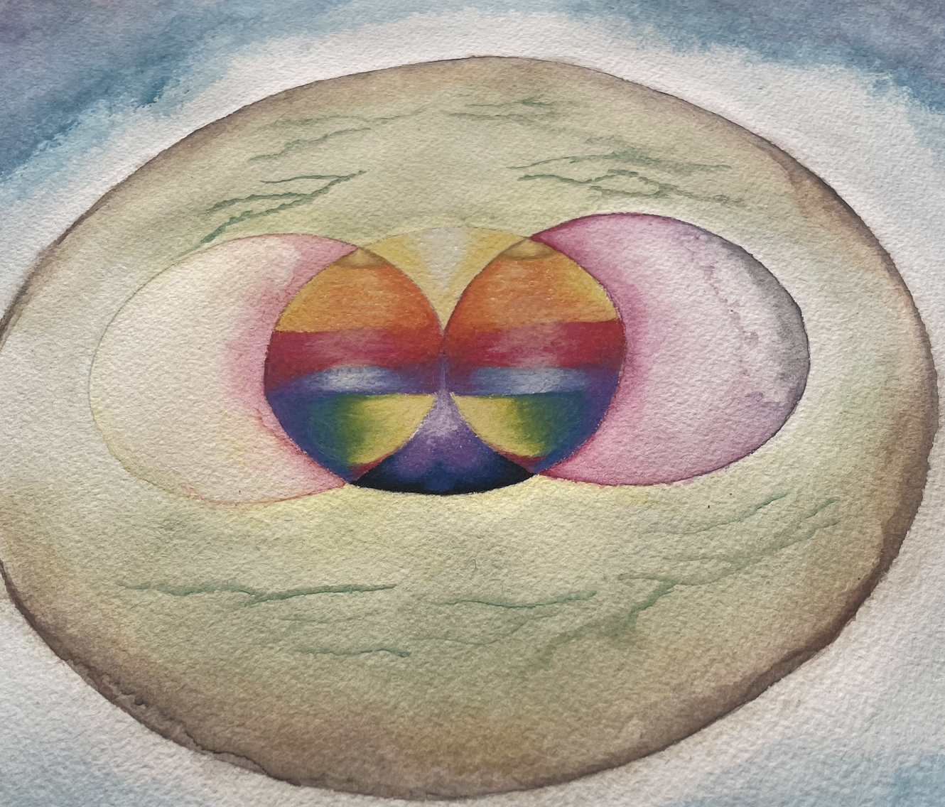 Three circles that are rainbow colored. The painting is in pastel and watercolor. 
