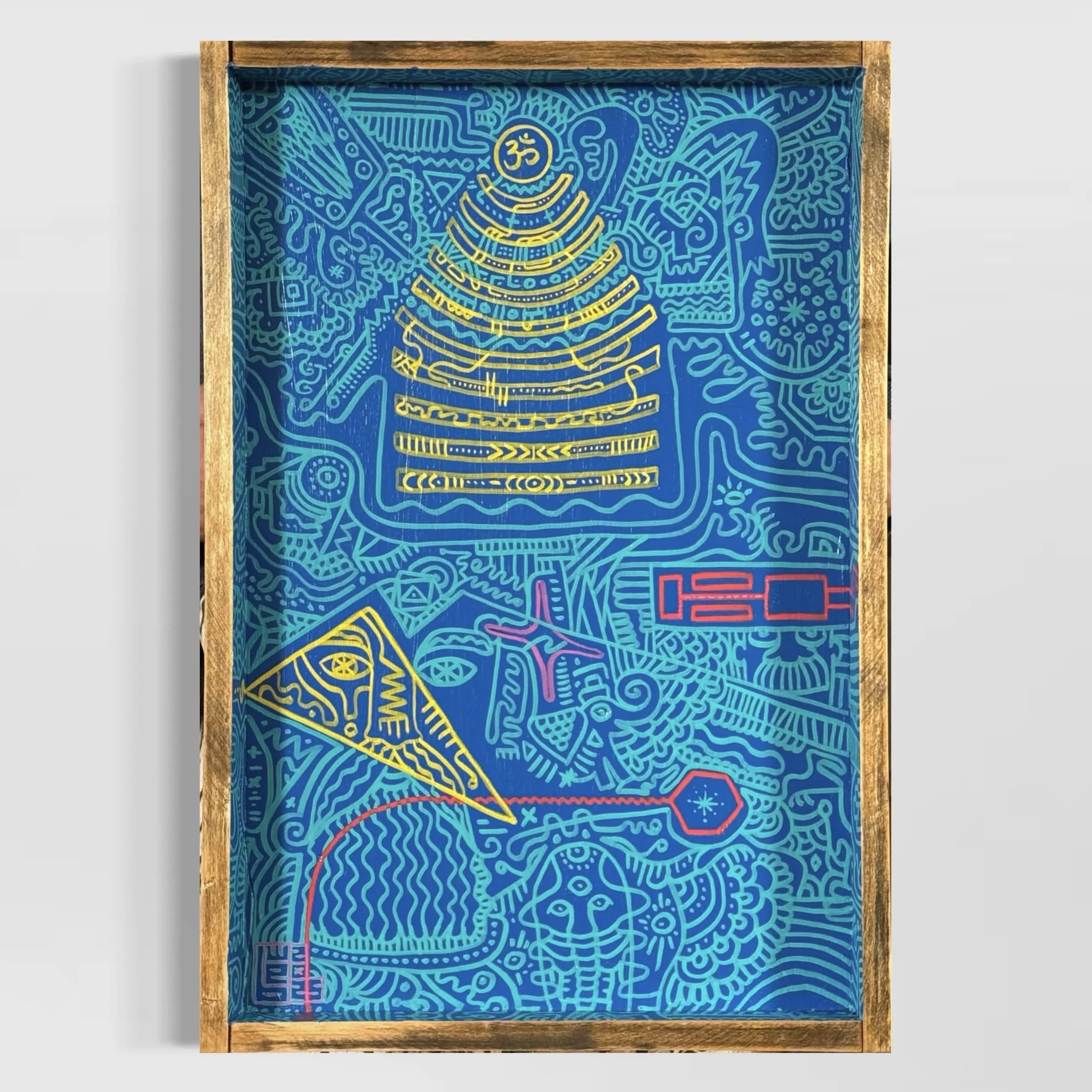 A colourful, abstract artwork with intricate line patterns in yellow, pink, and red on a blue background, on a wooden tray.