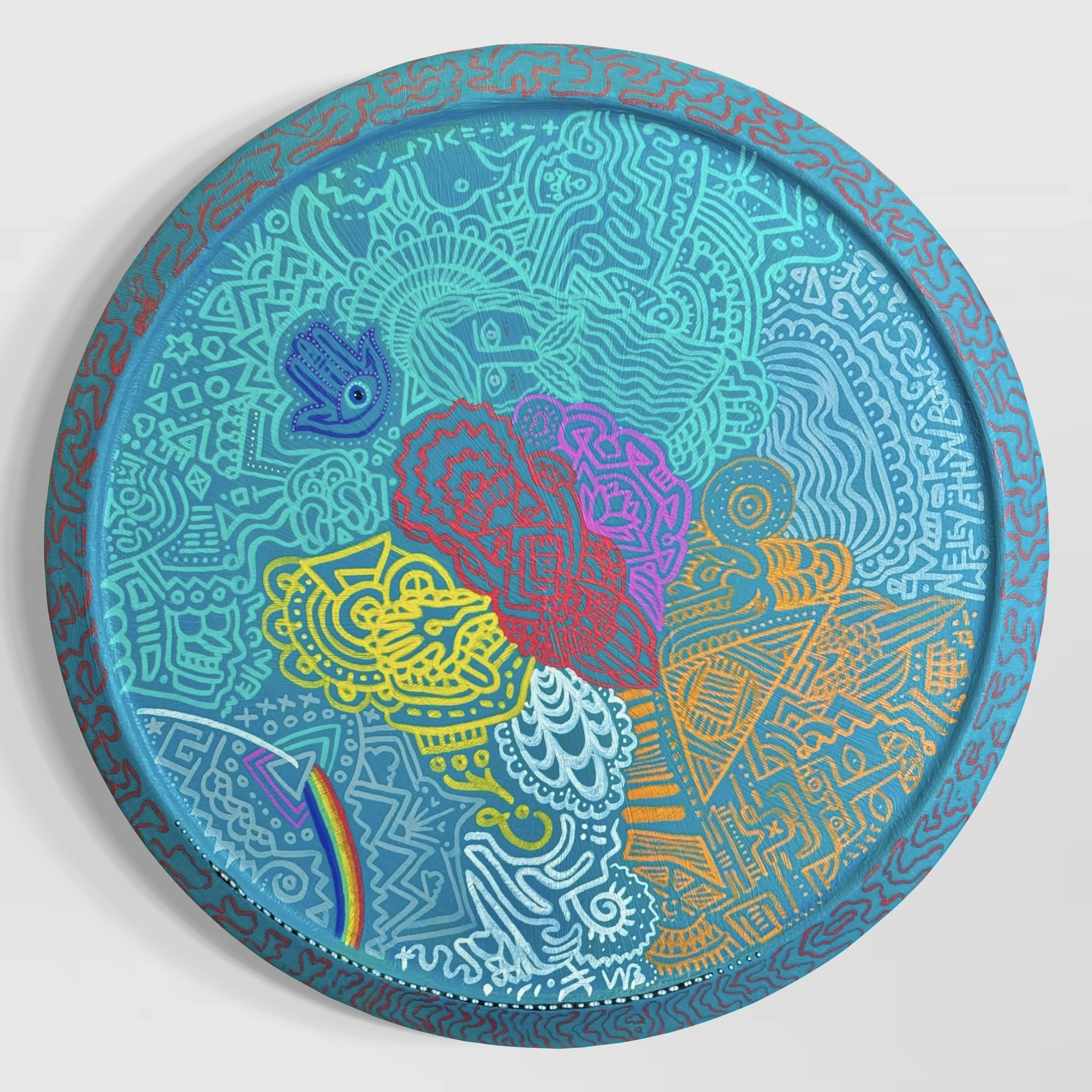 Colourful round art piece with intricate line work, geometric and abstract patterns, featuring a rainbow, a dove, roses, a star, and various symbols and designs painted on a lazy-susan.