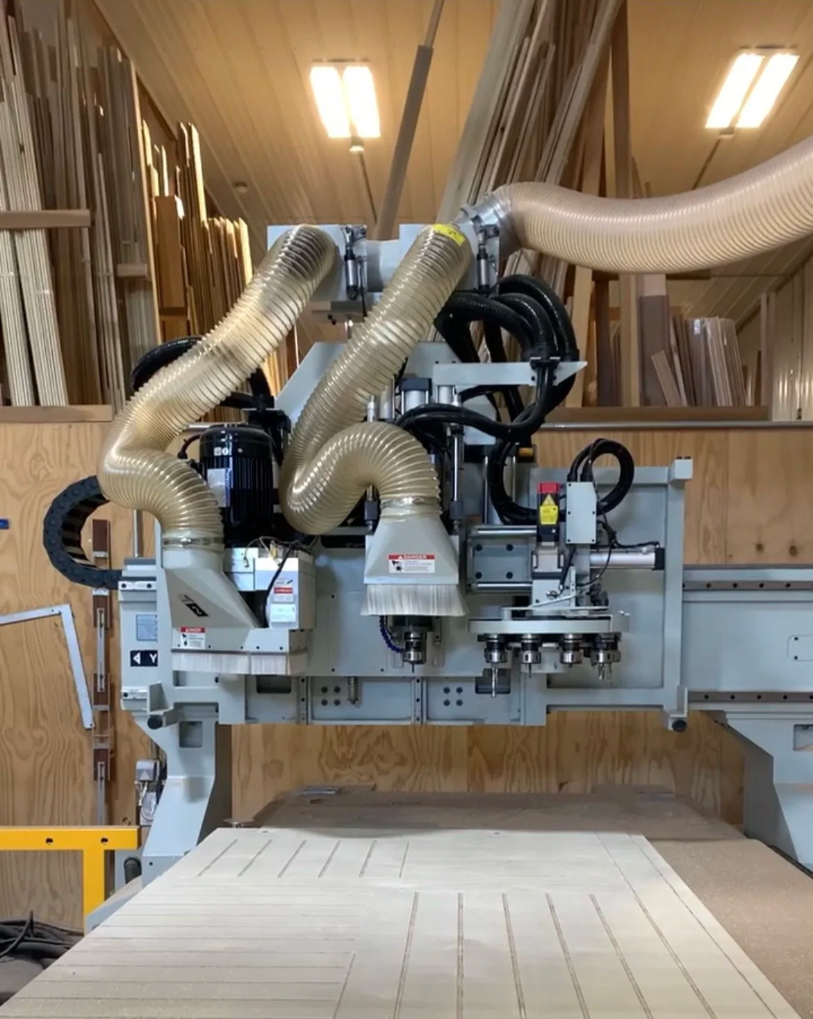 CNC router in a woodshop for cutting lumber and sheet goods.