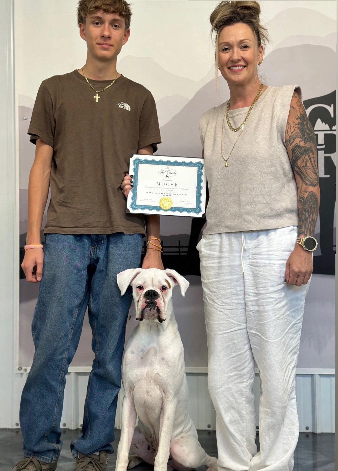 10-month-old Boxer puppy Moose graduating from a board and train program after transforming from an impulsive, high-energy dog into a well-mannered companion with improved obedience impulse control, and off-leash reliability. 