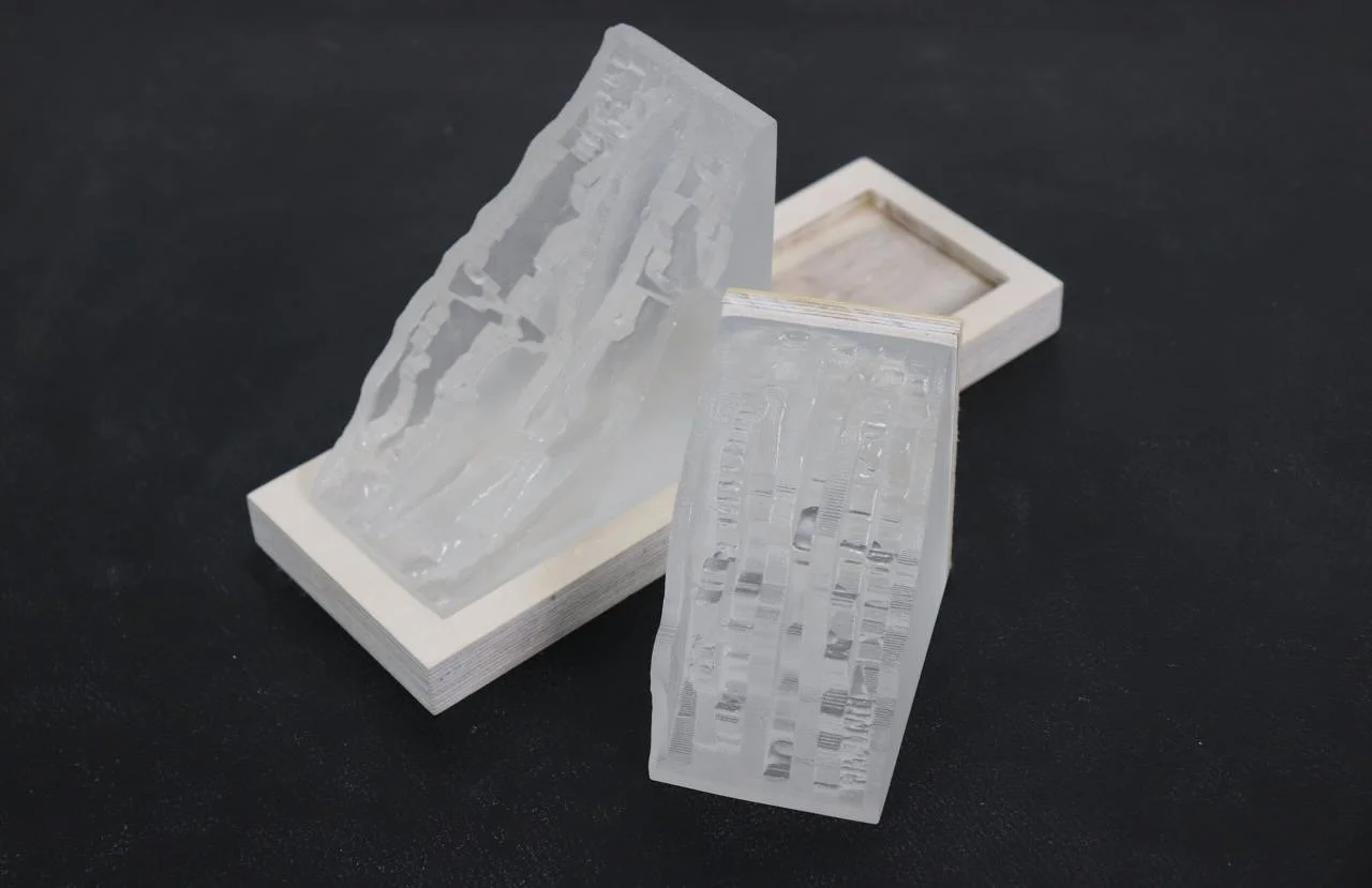 Each glass piece slightly differed in appearance due to the unpredictable nature of the glass casting process. However, these imperfections created beautiful individual pieces.