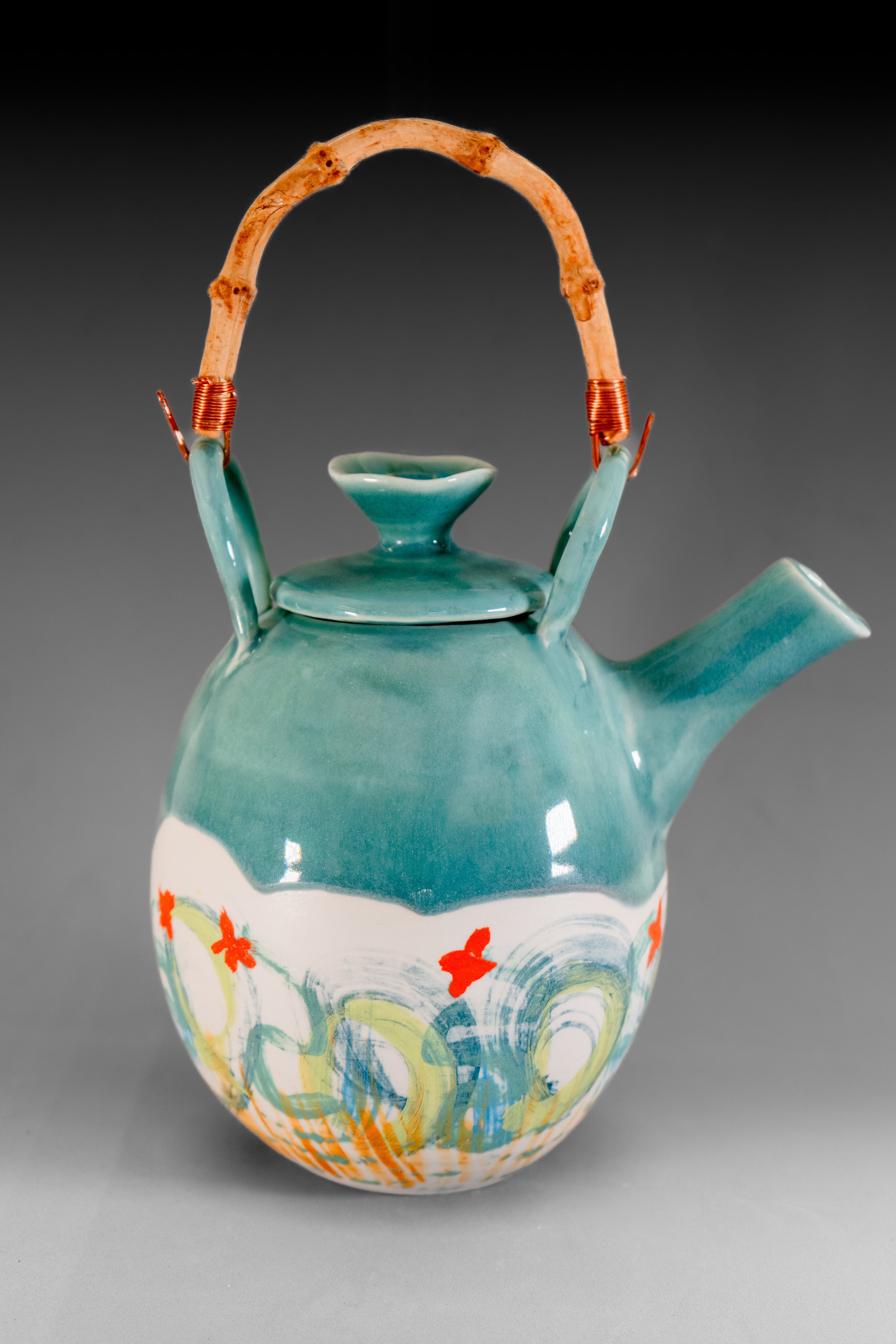 porcelain teapot with turquoise glaze and hand painted