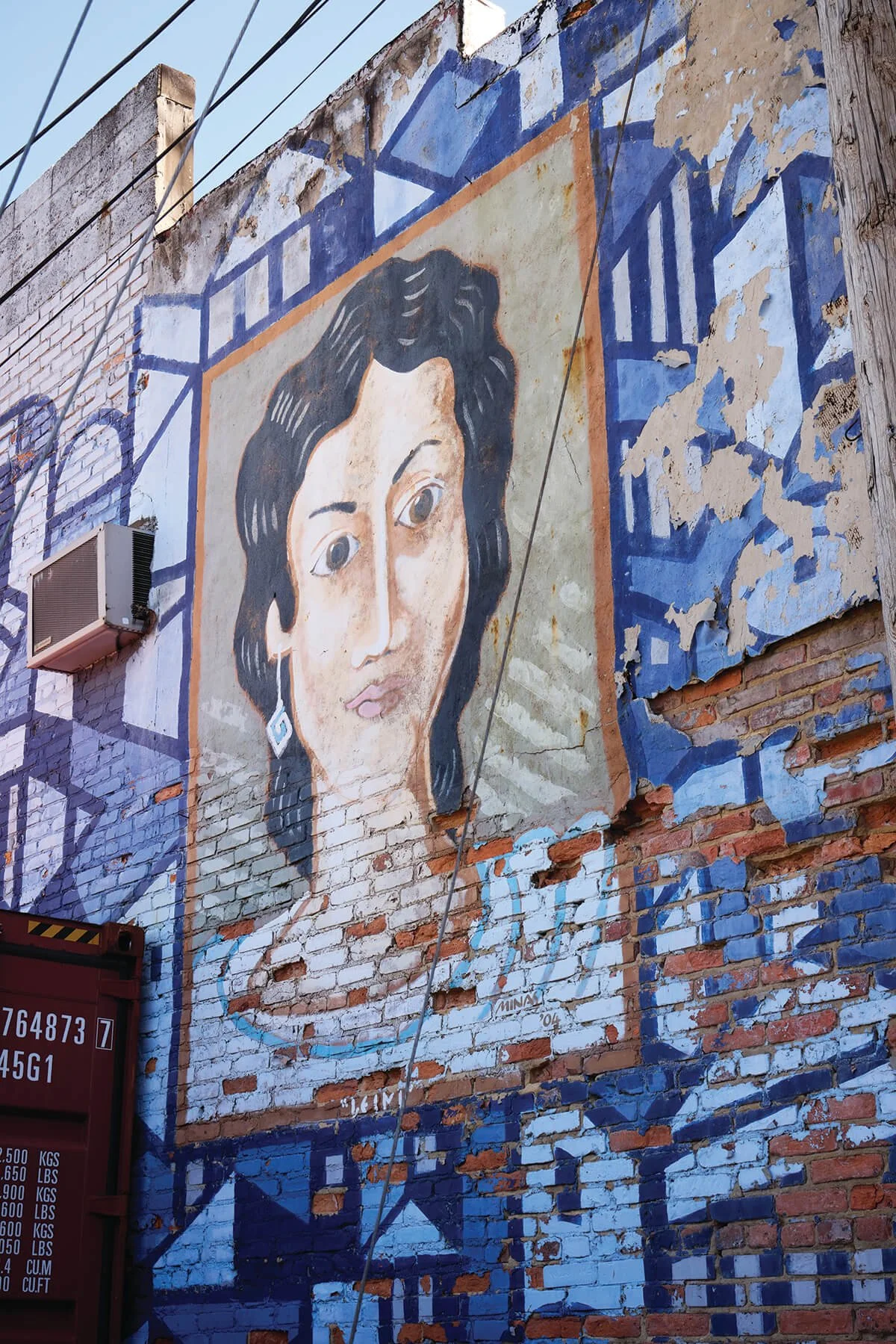 Mural by local artist, Minas Konsolas of Leini Leftafkis from the novel, Orlo & Leini. Photography by Tracey Brown/Papercamera