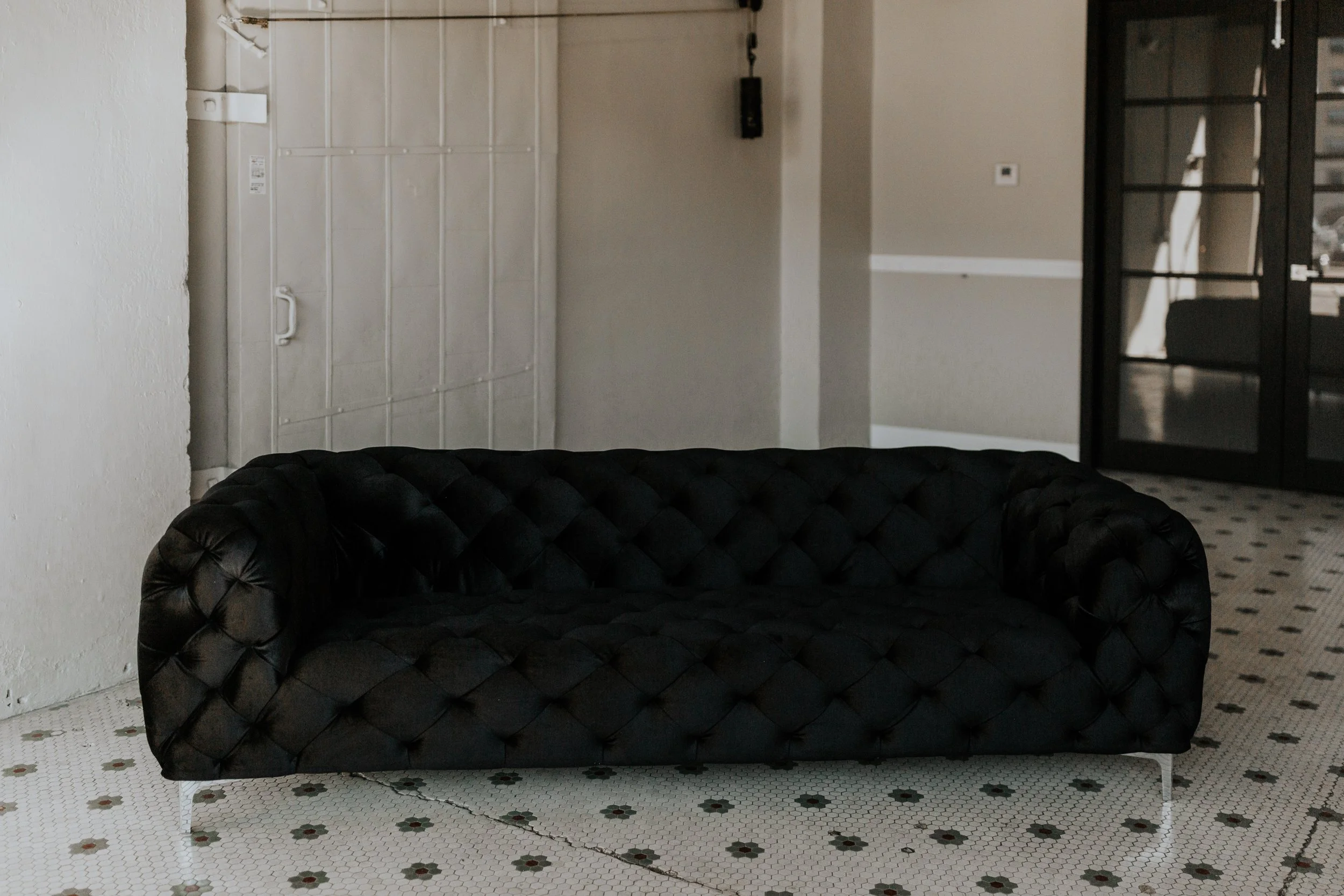 Black Velvet Tufted Sofa.jpg