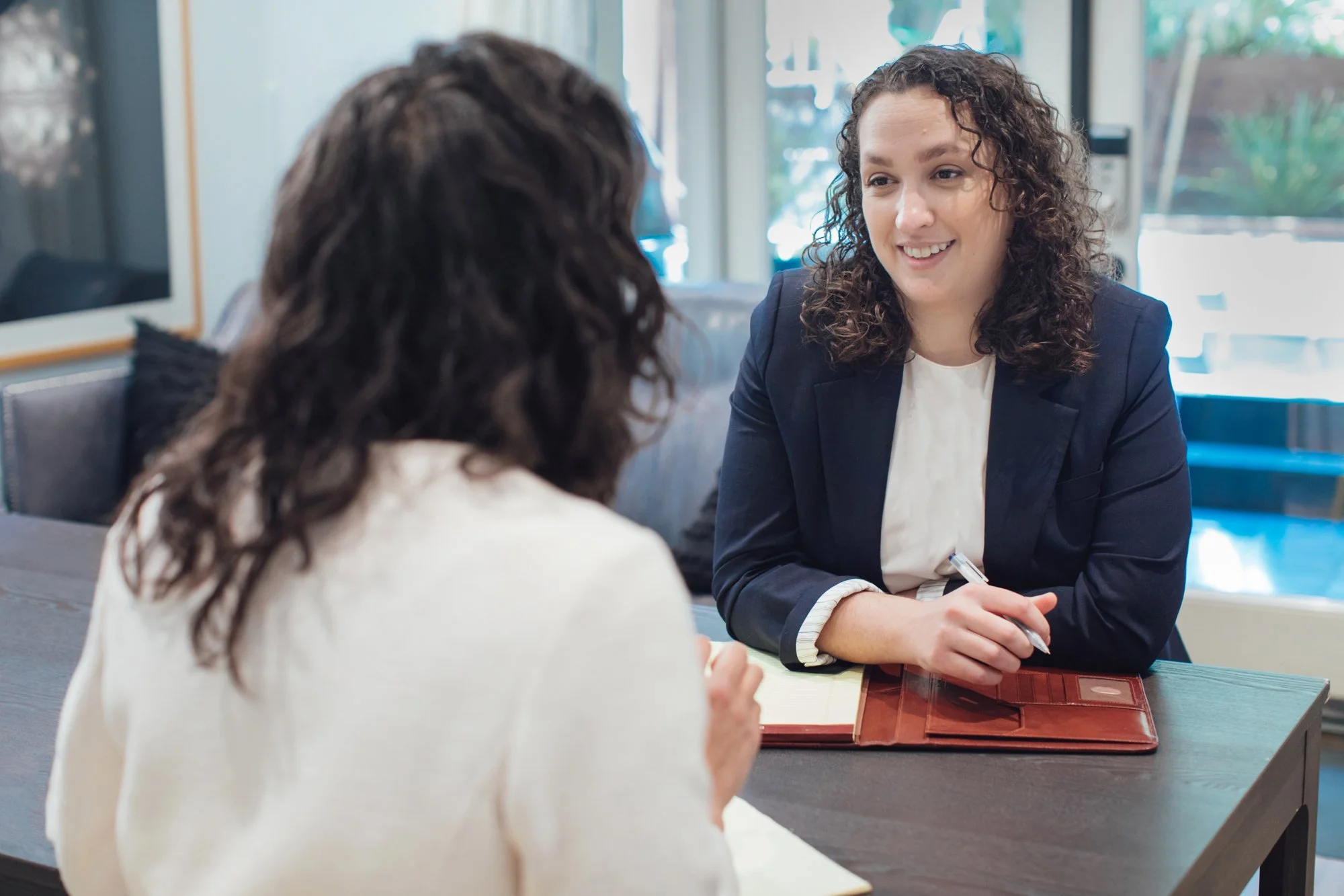 A hand holding a wedding ring symbolizing a divorce