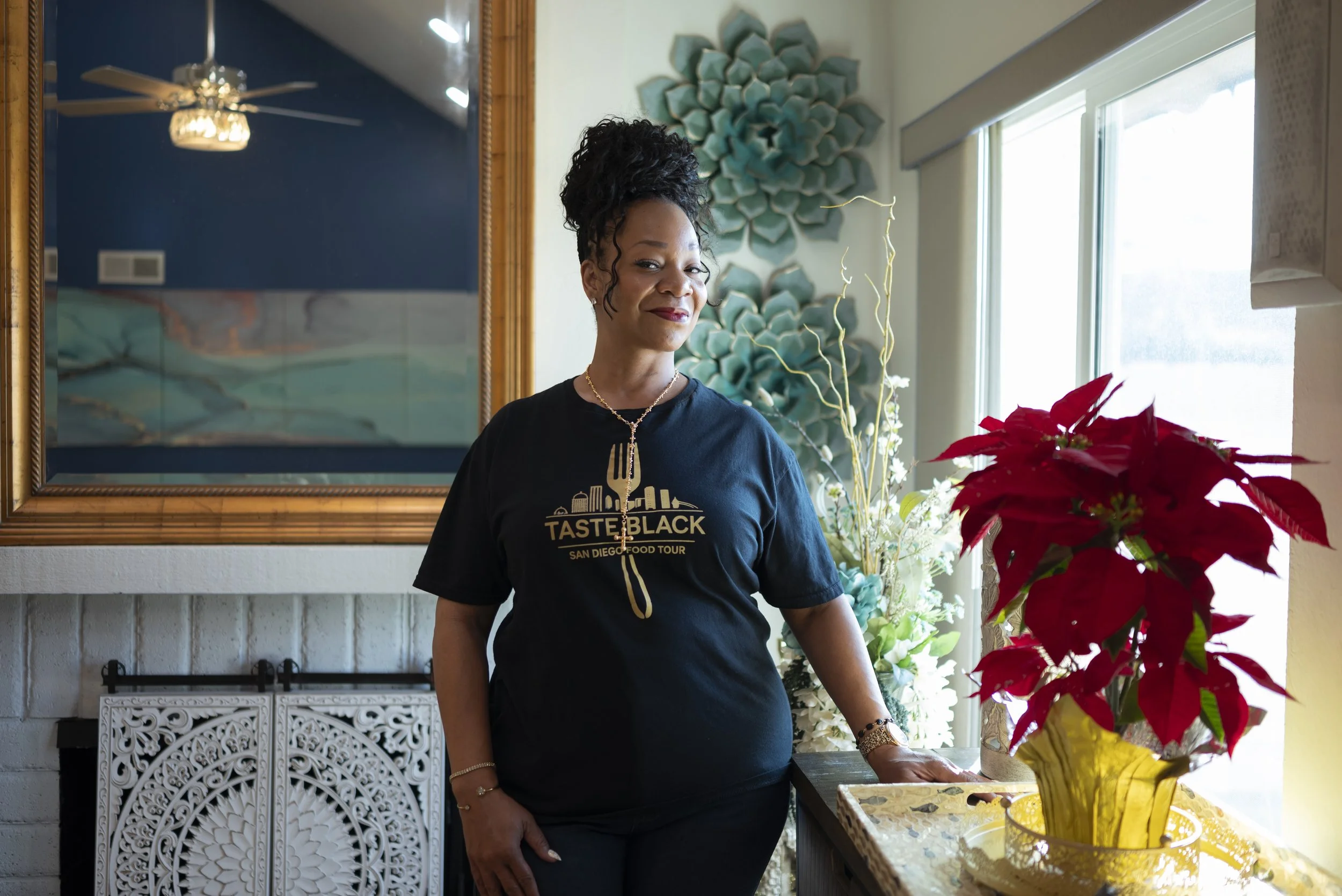 Bev Freeman stands in her living room for a portrait. Freeman is the founder and CEO of Taste Black — San Diego Food Tour, which spotlights Black-owned and chef-led restaurants throughout the city, December 17, 2025 (For The San Diego Union-Tribune).