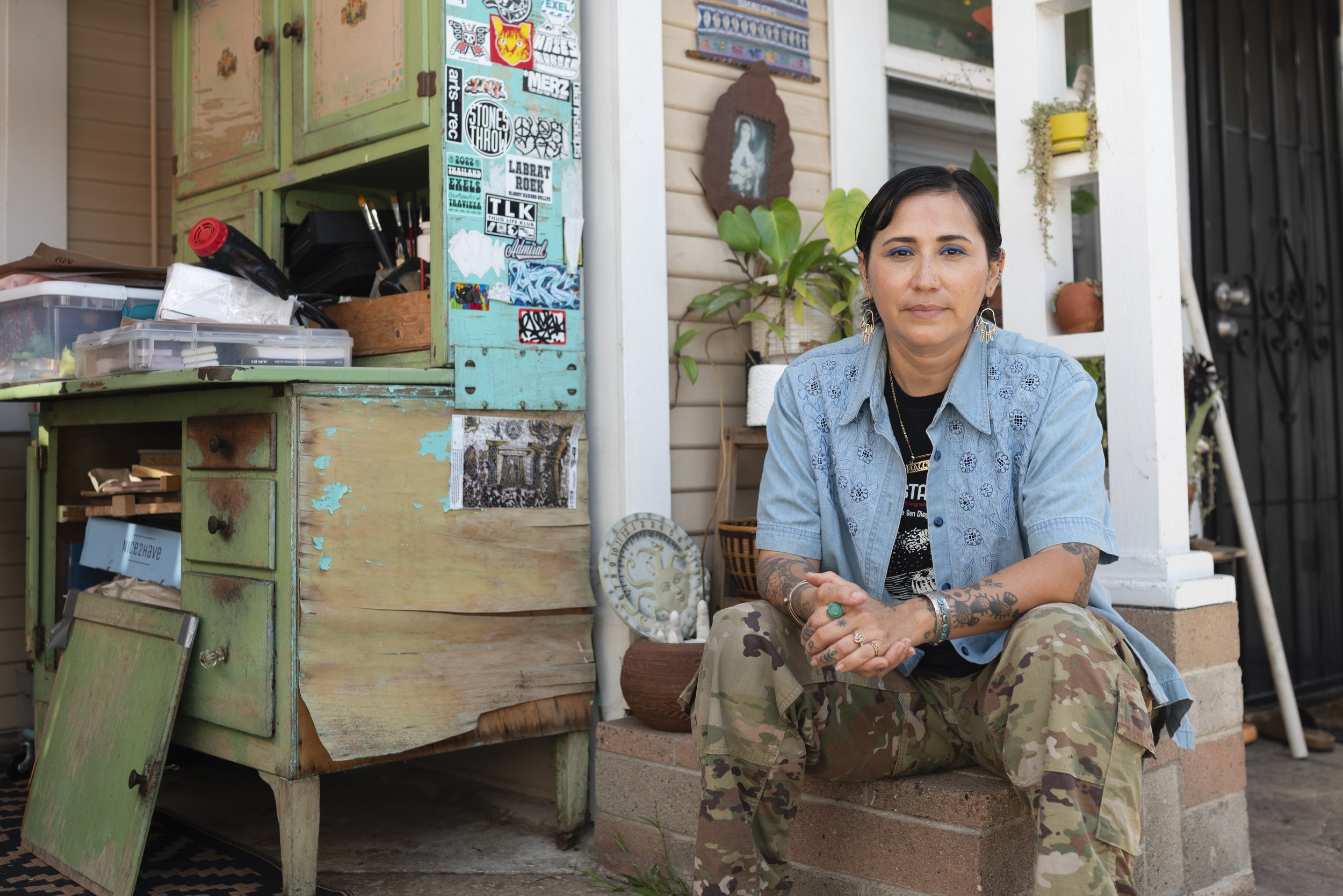 Multidisciplinary artist, printmaker and facilitator Irie Zepeda sits for a portrait at their home in San Diego on April 9, 2026. (For The San Diego Union-Tribune)