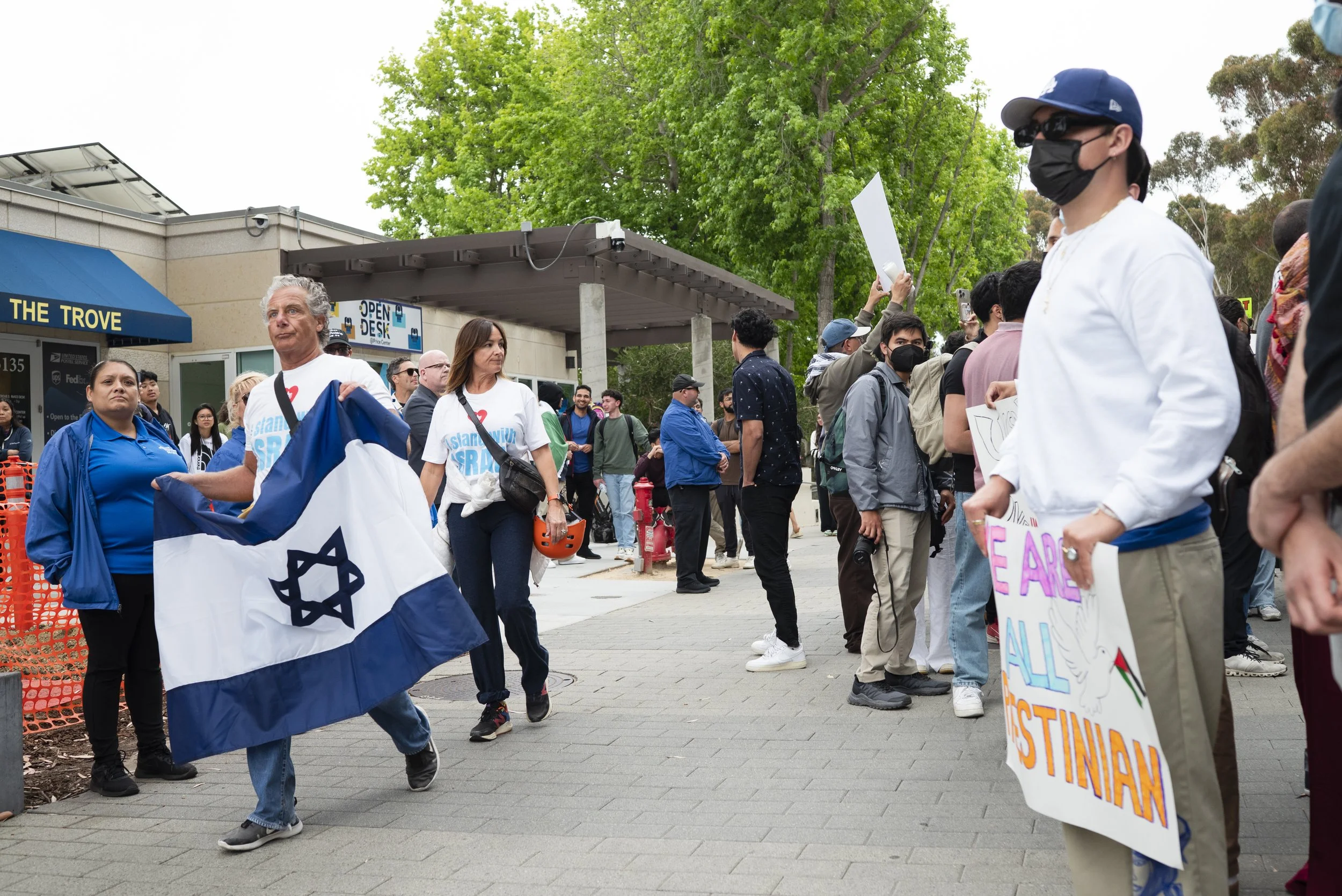 UC San Diego, May 14, 2024.
Pro-Israel protesters pass by CAIR's press conference while heading towards Geisel Library.
