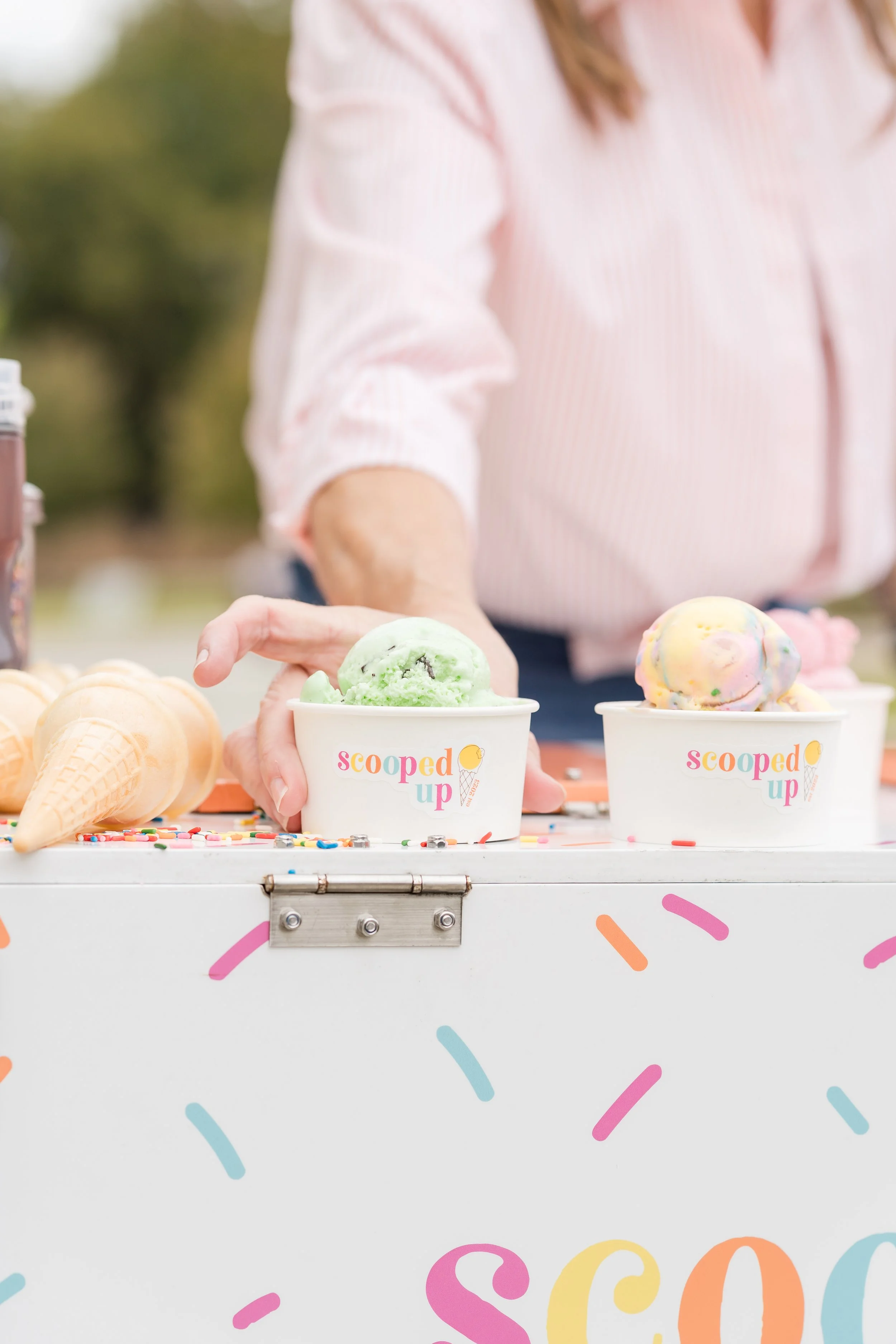 Ice cream in cups on the ice cream trike
