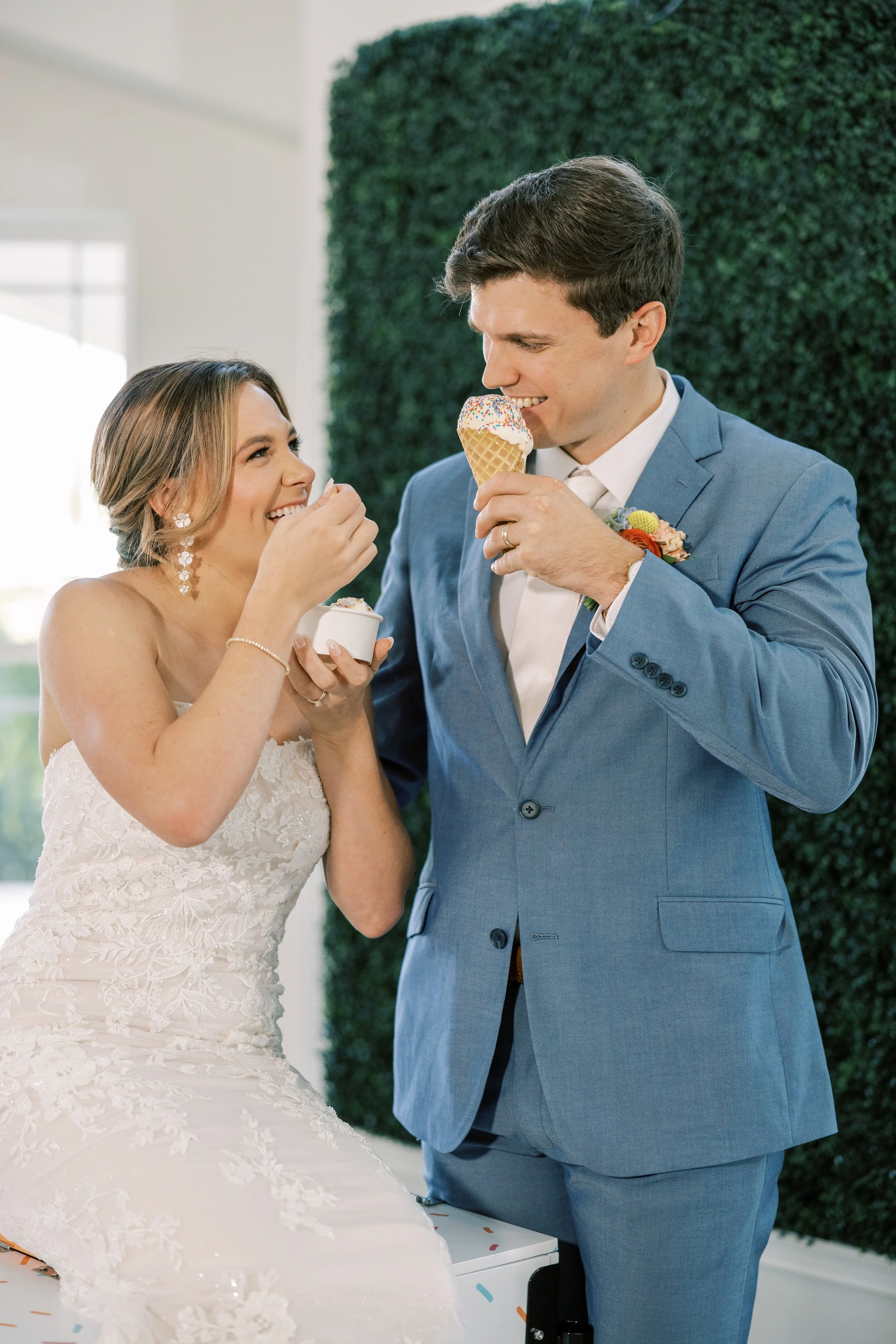 Bride and Groom eating ice cream at their wedding