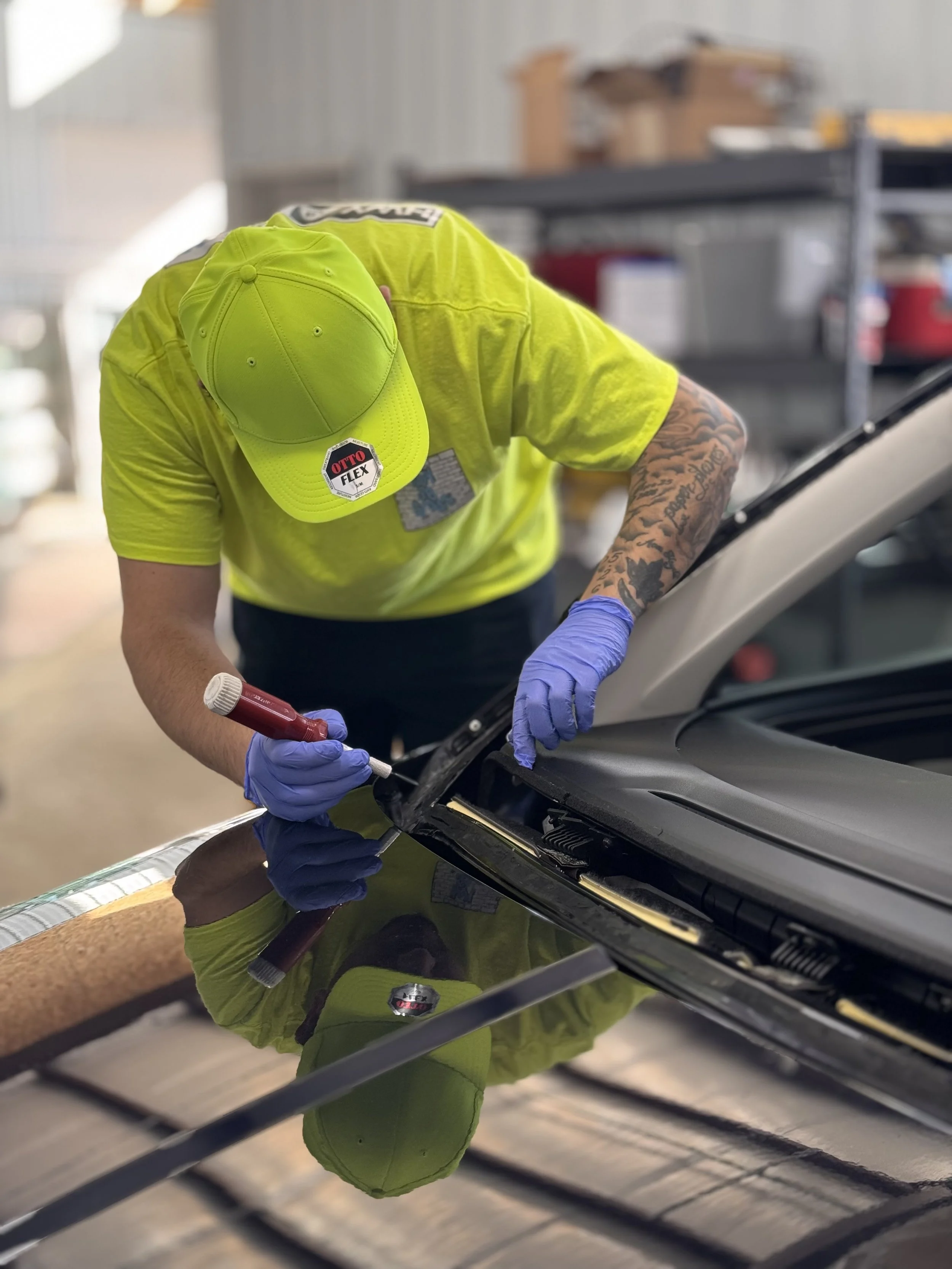 Technician performing windshield replacement and auto glass repair at HWY 38 Glass in Northern Utah, providing professional mobile windshield service and insurance-approved auto glass installation.