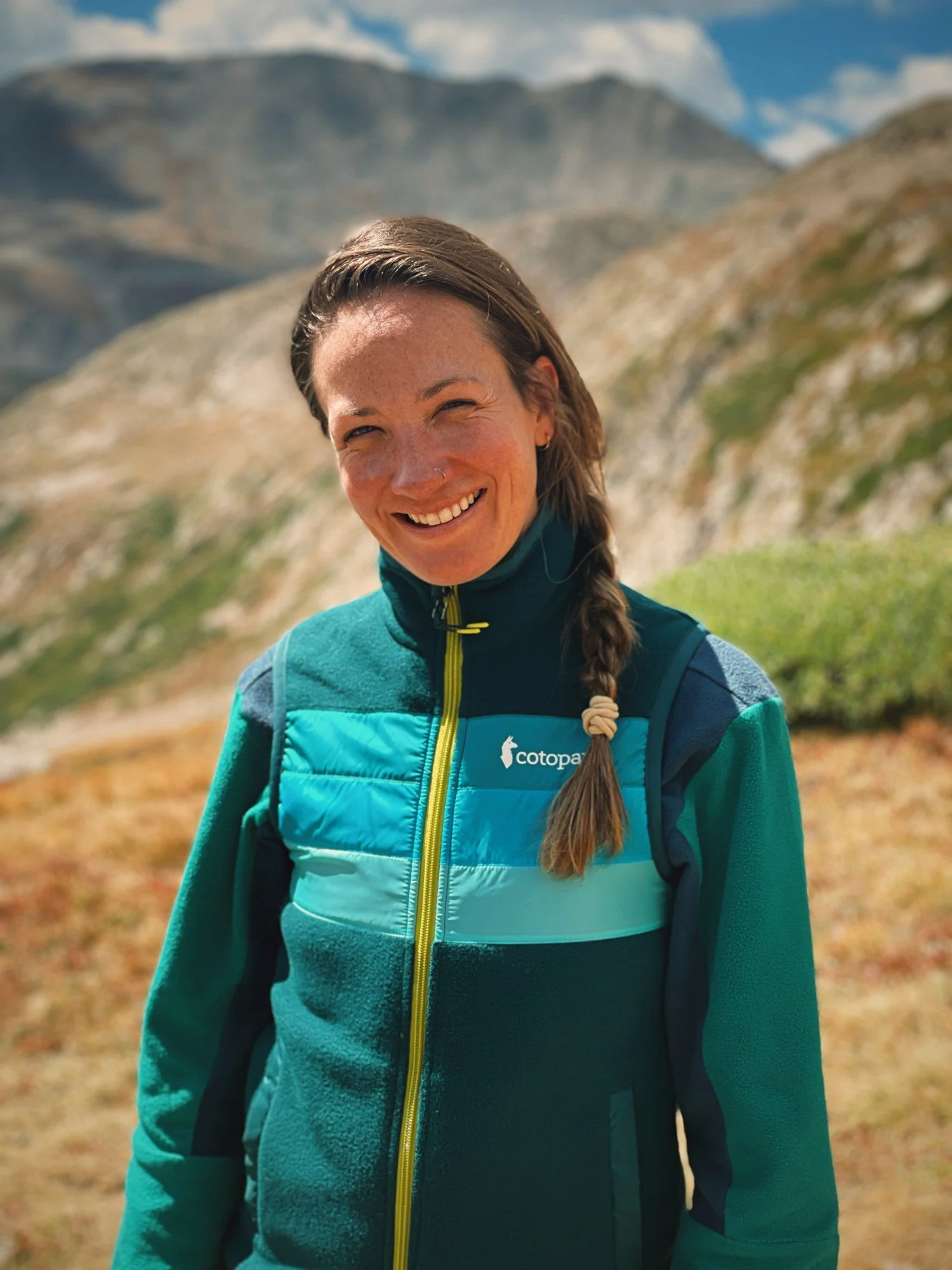 Morgan Busse, DNP, FNP-BC, MSCP, smiling outdoors in the Colorado mountains