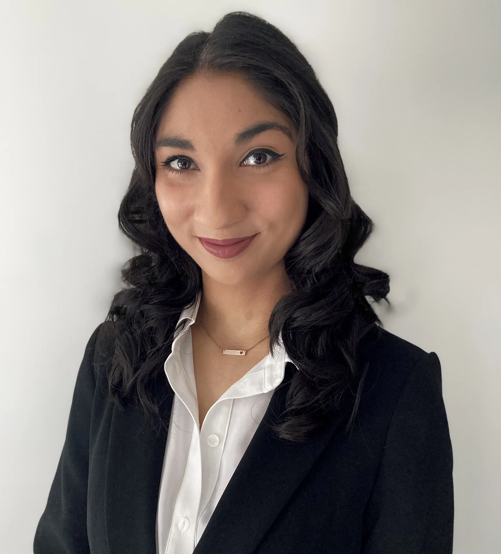 image of Aria in a black blazer and white shirt