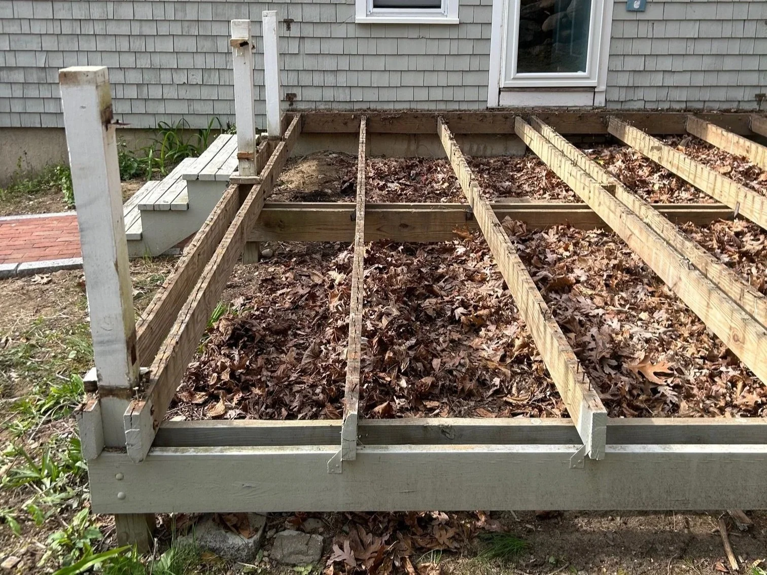 deck before remodel with old wood and falling apart