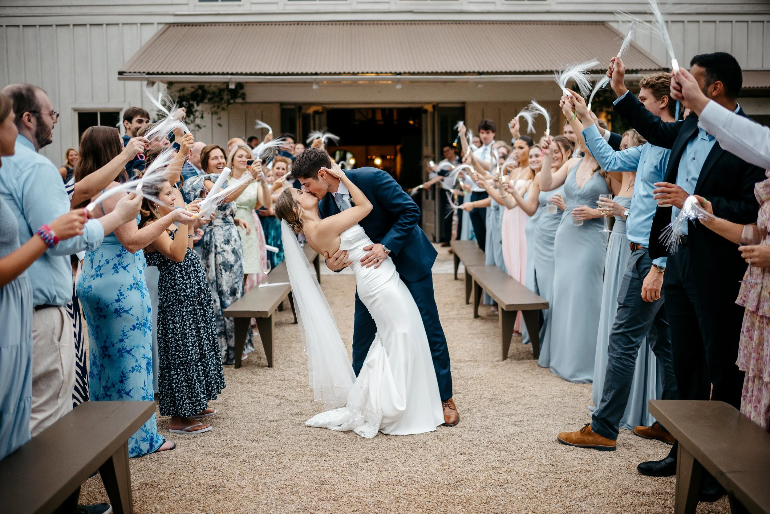 Bride and groom kissing during their exit at a Cincinnati Ohio wedding.