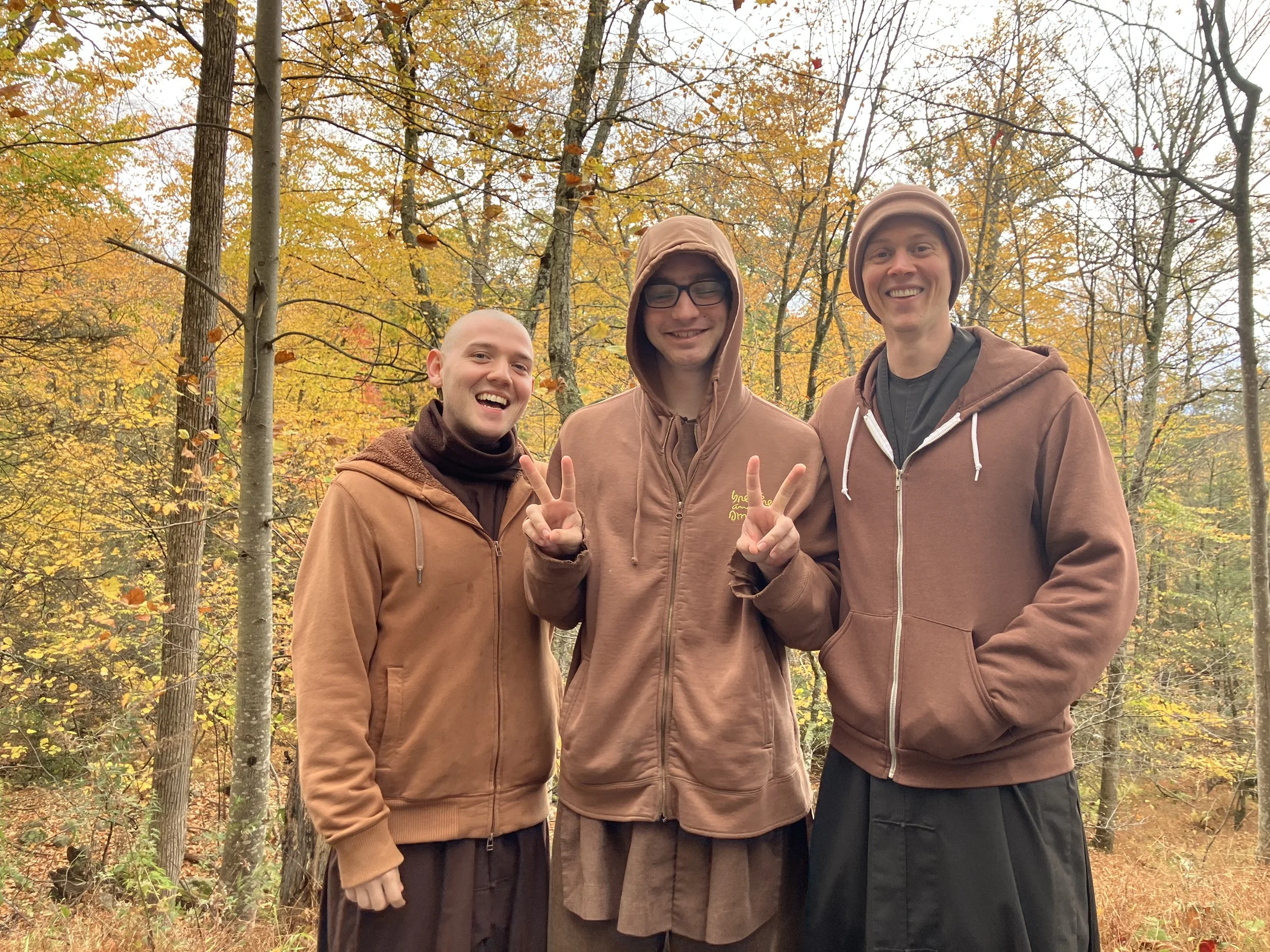 Three newly-ordained novices enjoying the golden autumn at Blue Cliff Monastery: Br. One Mind, Br. One Peace, Br. One Earth.