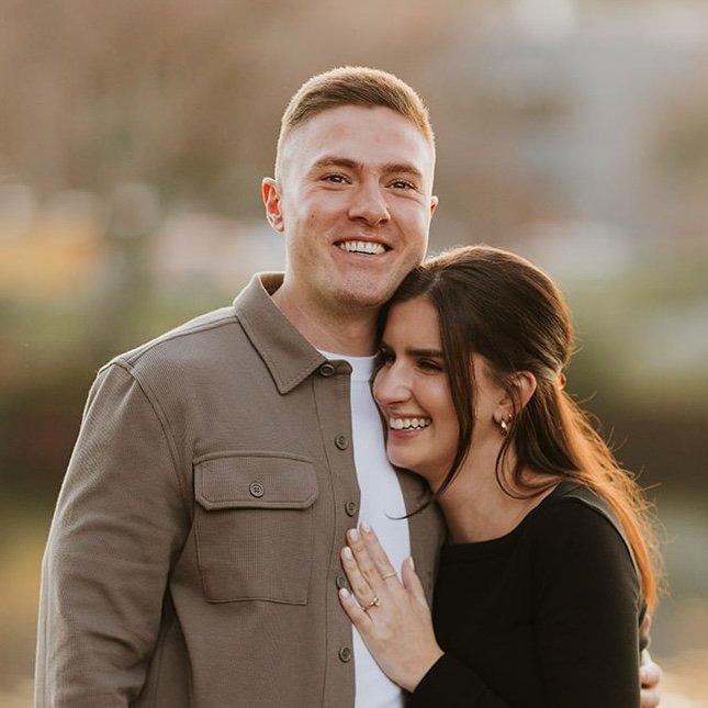 Engaged couple embracing after a successful proposal — part of a photo package planned and styled by a professional proposal planner