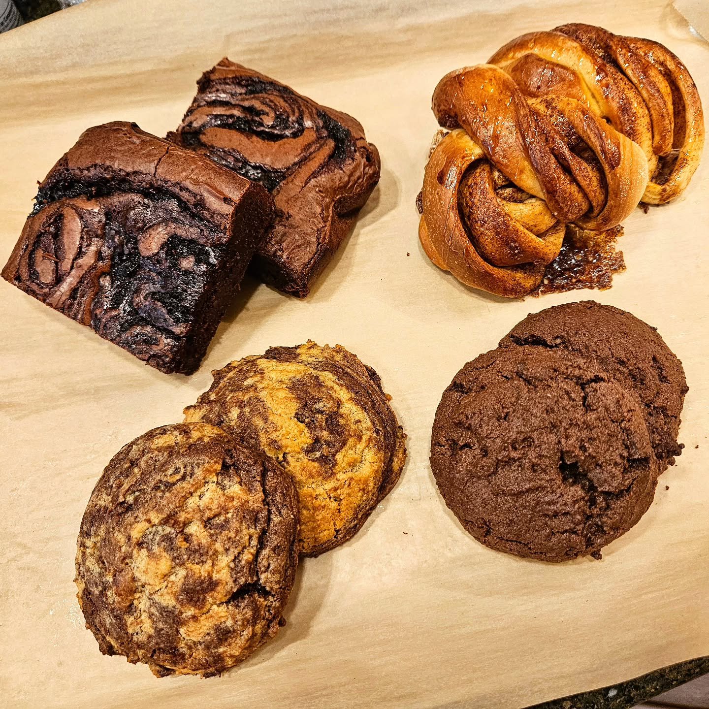 Small selection of offering from this weekend...

Hop on our weekly email list at eatgratefull.com to stay in the know!!

Clockwise from top right:
Cinnamon Knots 
Double Chocolate Cookies
PB Choc Cookies
Black Forest Brownies (weekly special)