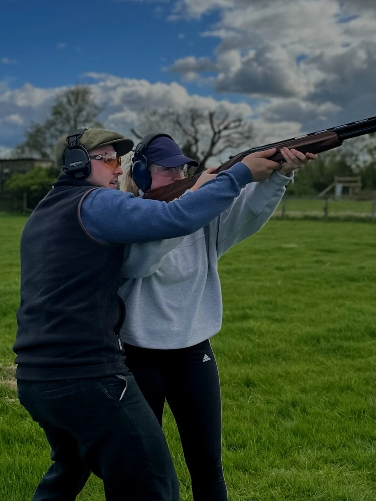 Clay shooting experience — two people at a shooting ground
