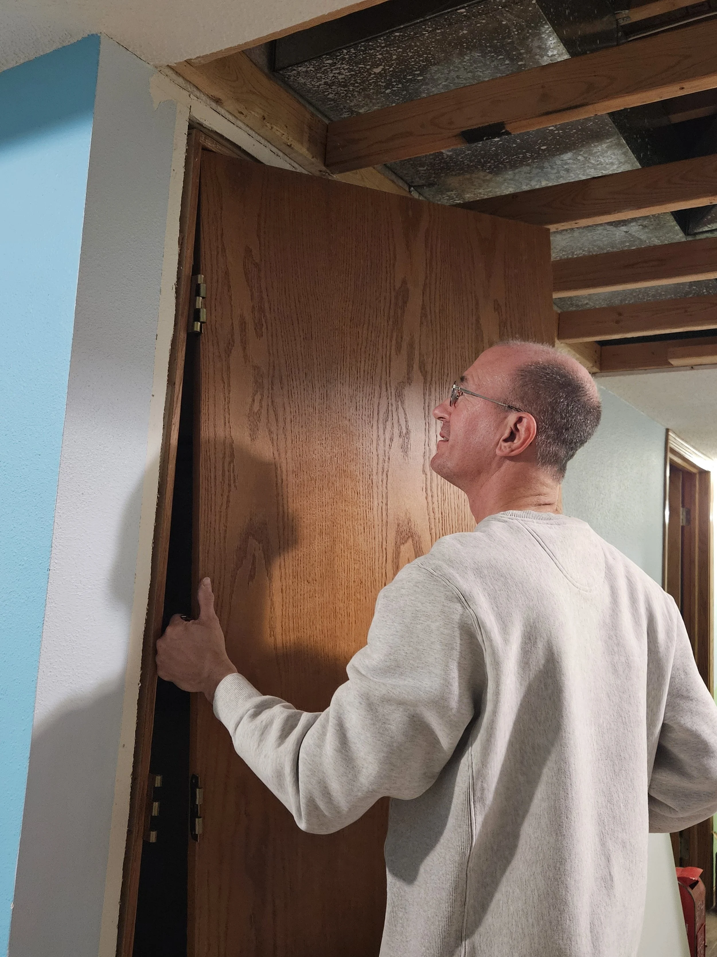 Randy is installing a new interior door.