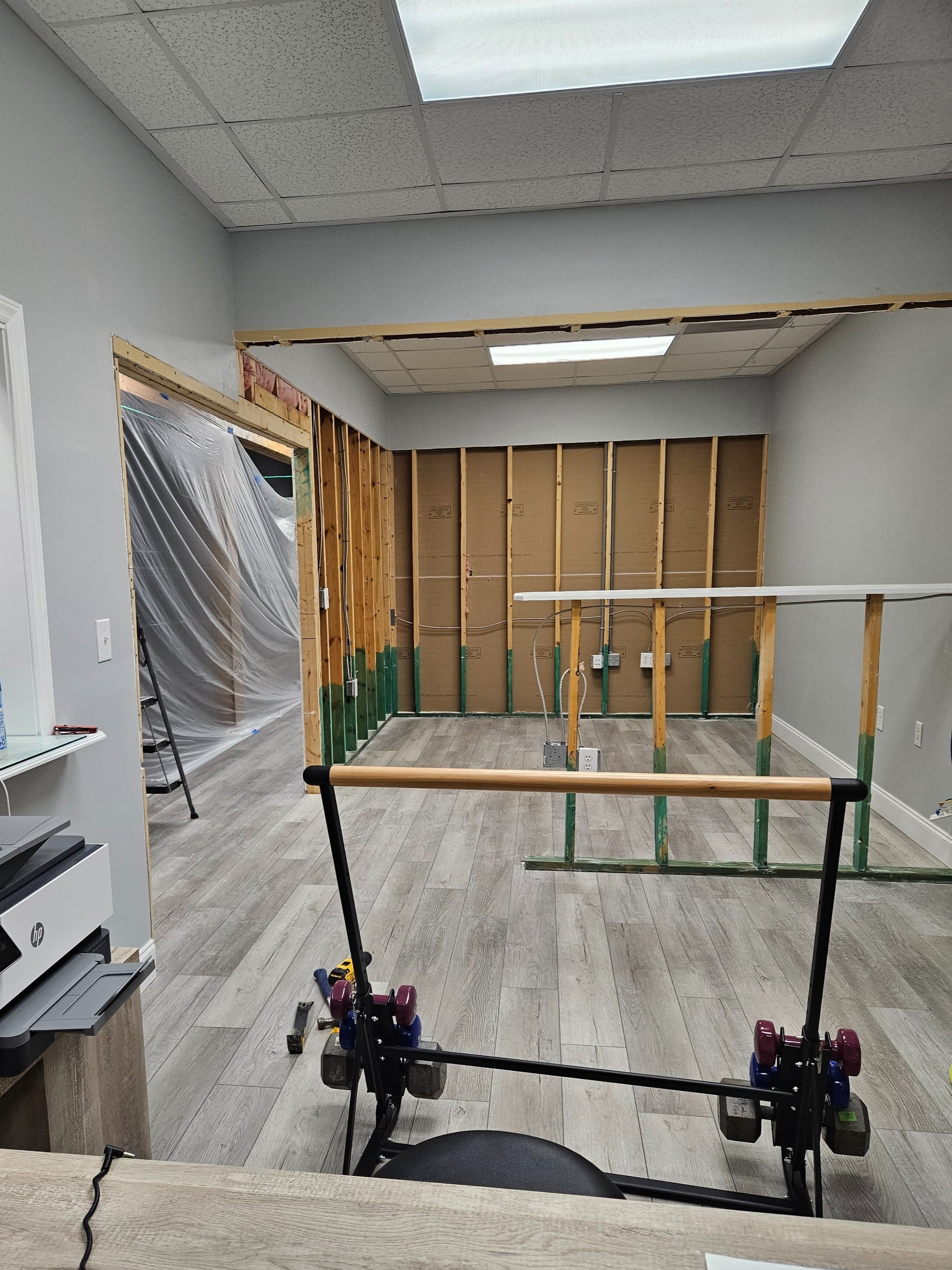 office renovation, drywall repair, in progress