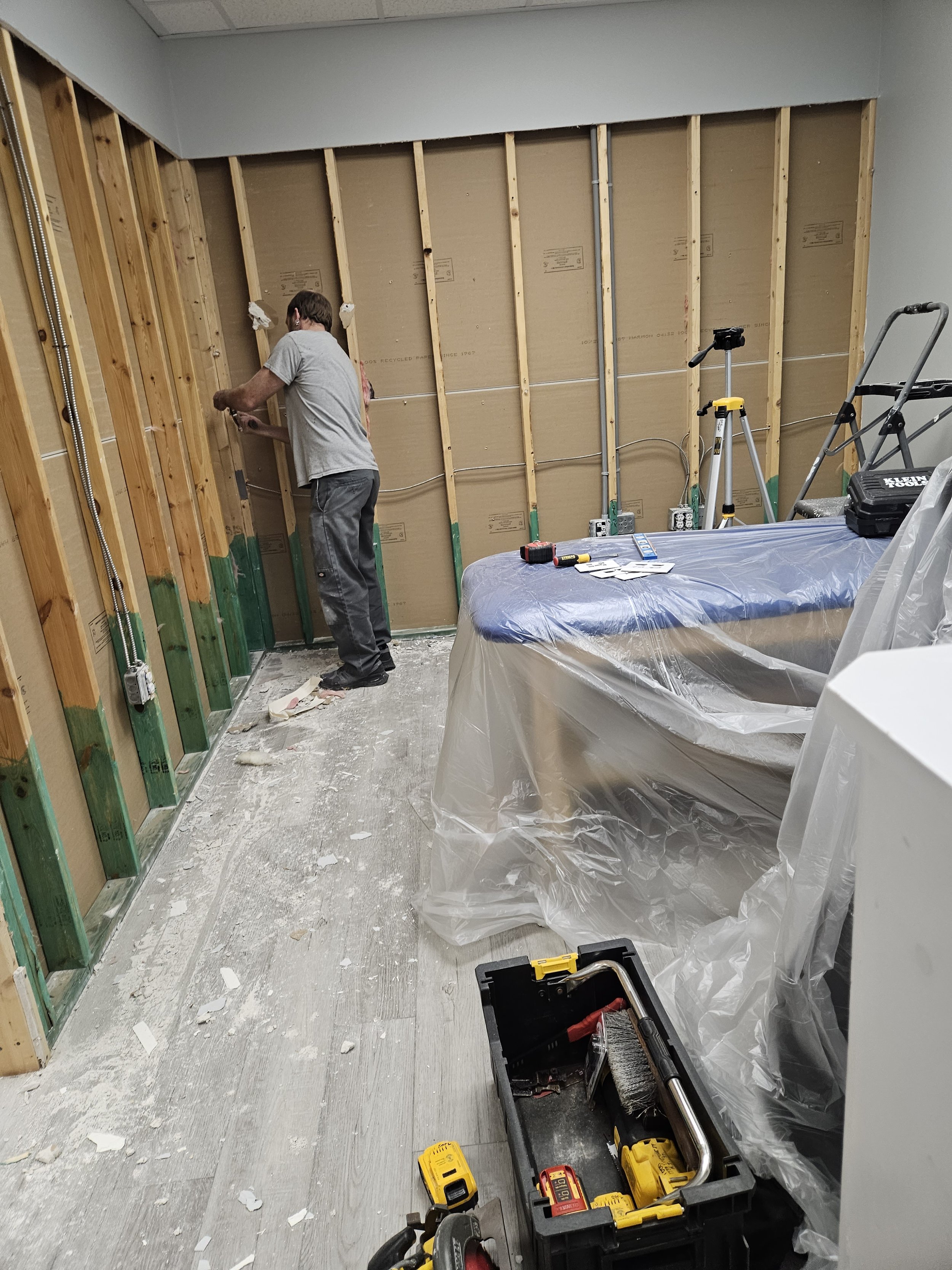 office renovation, drywall repair, in progress