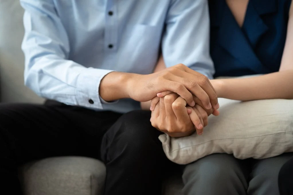 Couple joining hands