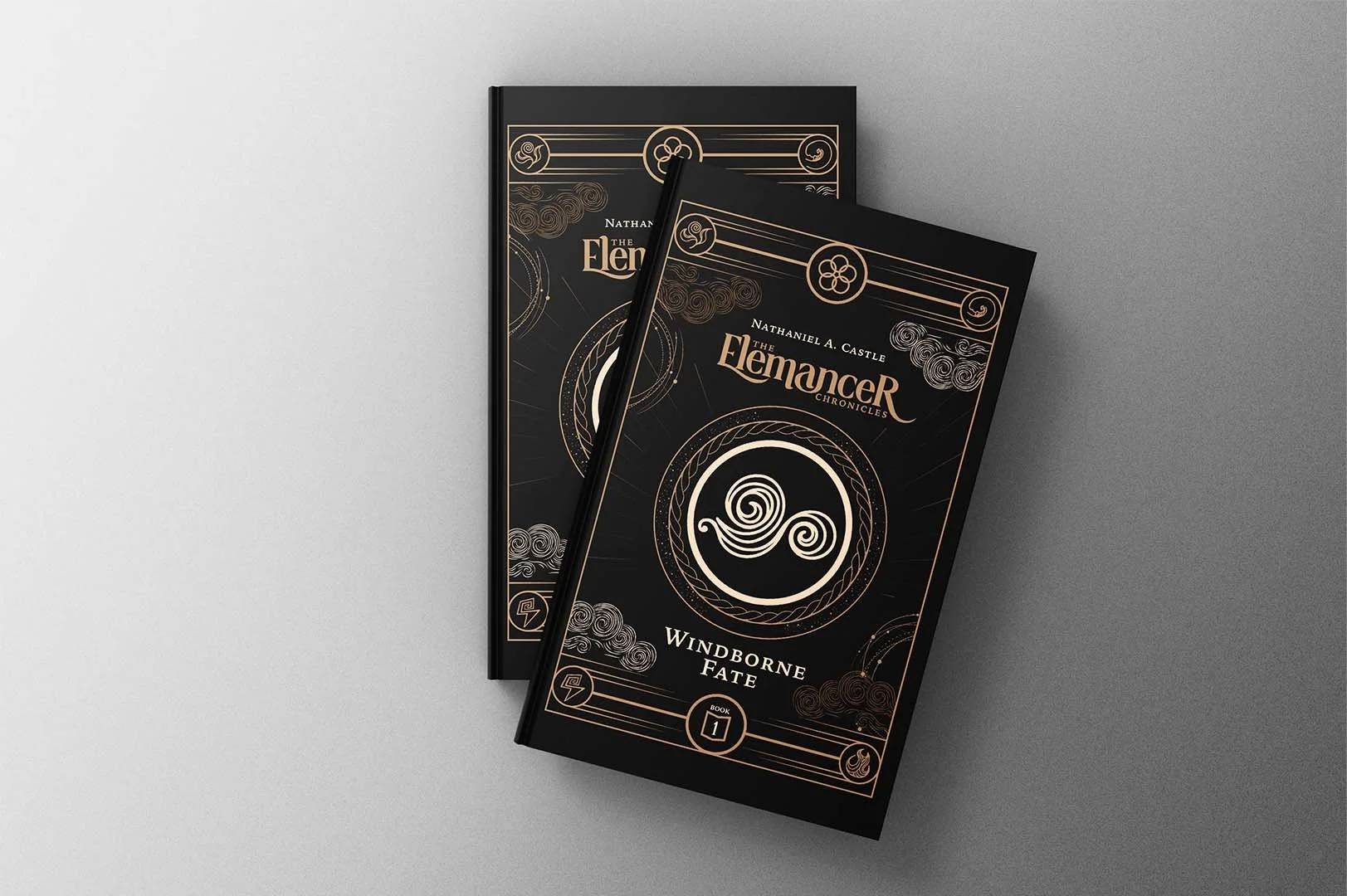 Two black book covers titled "The Elementer Chronicles: Windborne Fate" by Nathaniel A. Castle, with intricate gold and white designs and symbols on a gray background.