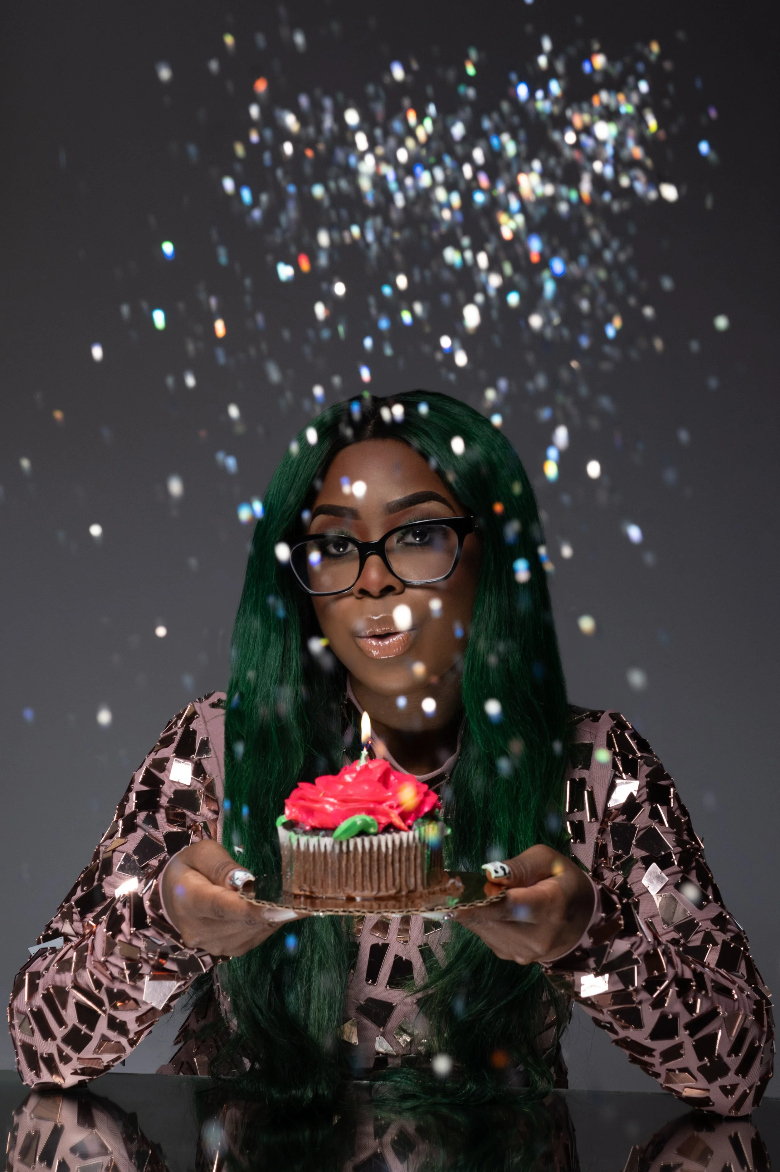 Christy Chiakpo Blowing out candle personal headshot Christy C