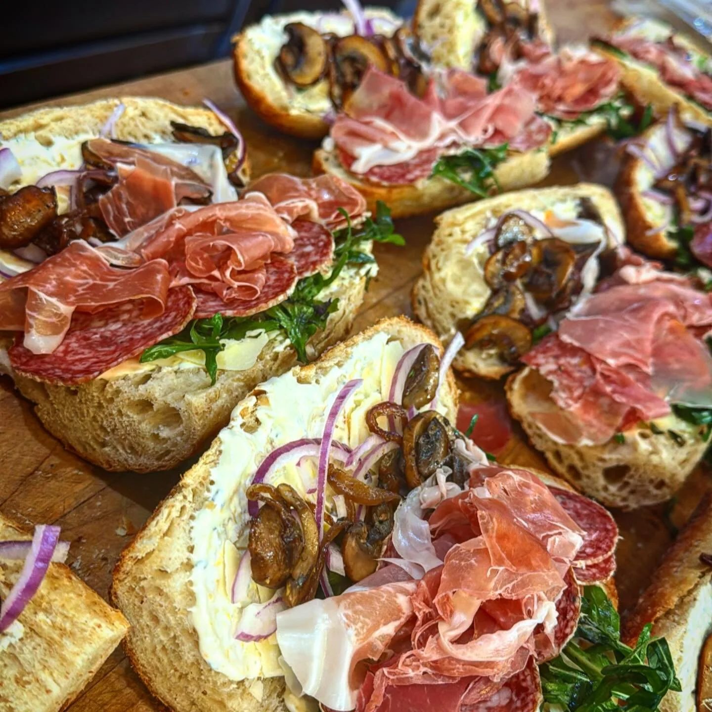 Tuesday Chomps: Citrus &amp; sage cr&egrave;me fraiche, saut&eacute;ed mushrooms, prosciutto, thin sliced salami, with Parmesan and an oregano arugula herb blend.

Come in while supplies last!!