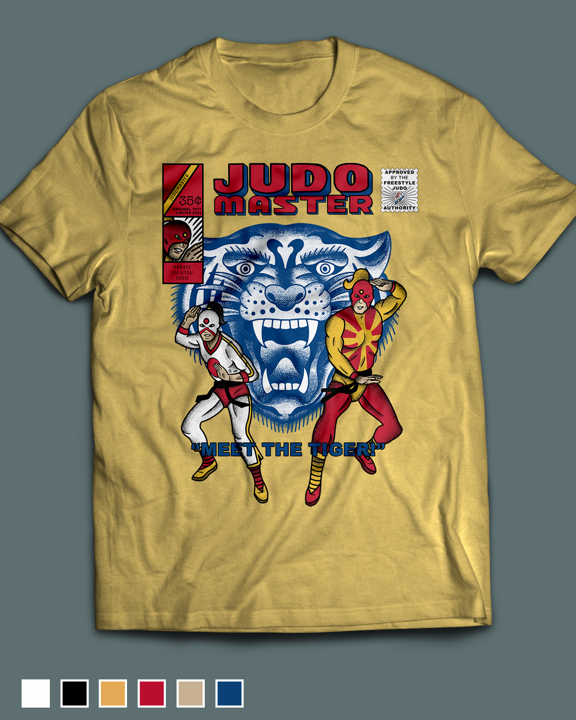Yellow T-shirt featuring comic style artwork with a tiger face, two masked wrestlers, and bold text reading "Judo Master" and "Meet the Tiger," along with a comic strip postage icon.