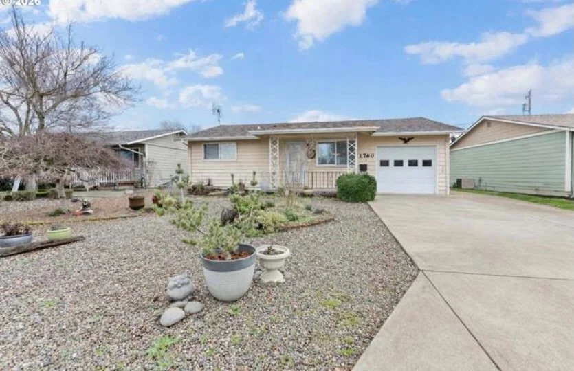 Enjoy everything this home has to offer in the desirable 55+ Woodburn Estates Community. This well maintained home features new HVAC- installed Oct 2025, water heater and newer roof, low-maintenance yard, and large covered patio. The laundry room inc