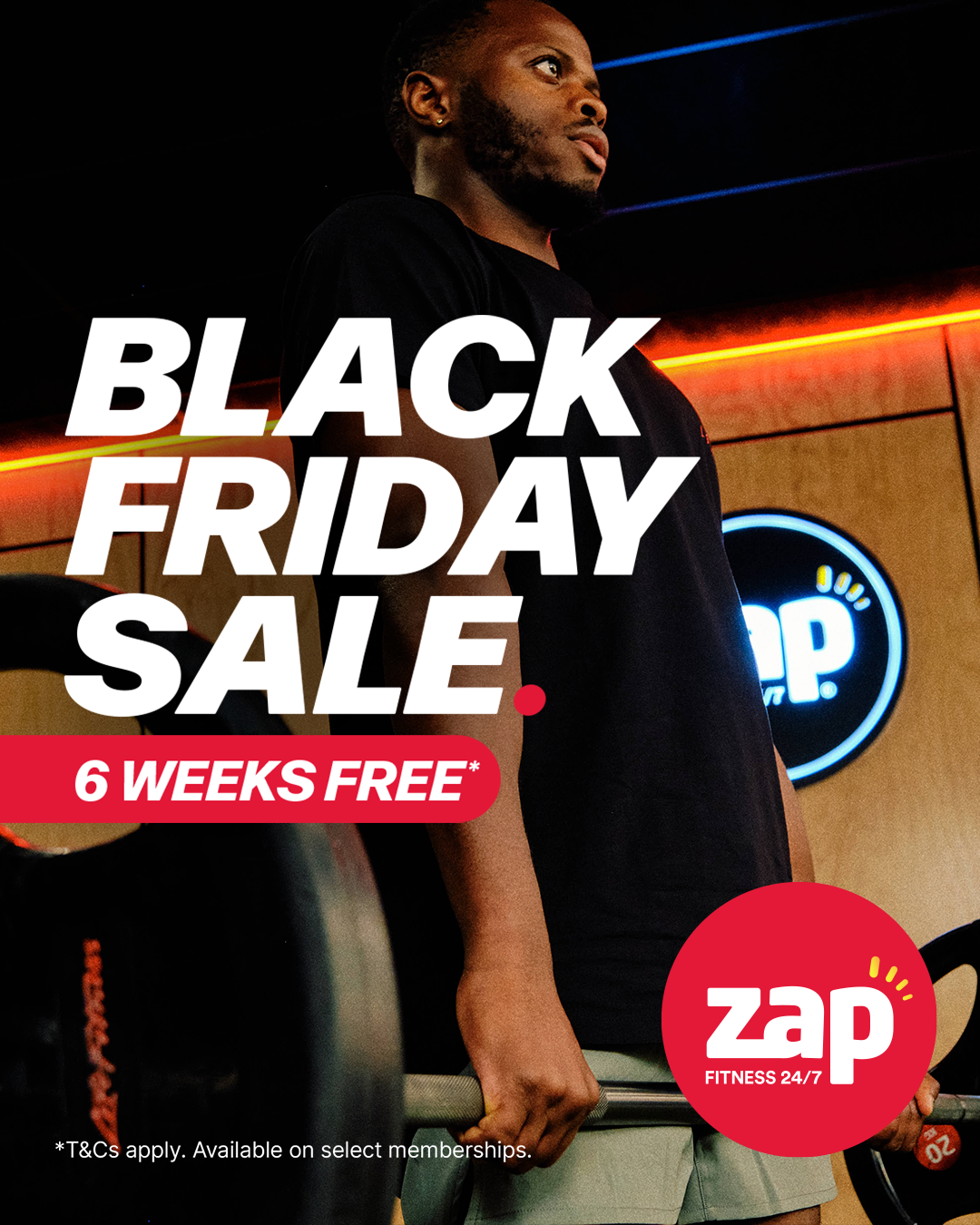 A person lifting a barbell in a gym with a 'Black Friday Sale' advertisement overlay, promoting 6 weeks free at Zap Fitness.