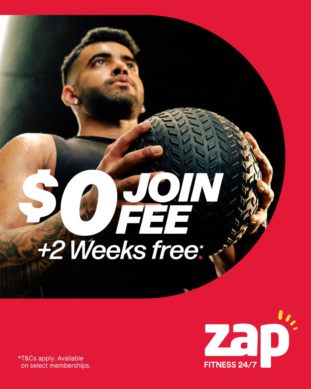 A man holding a large black tire at a gym with a red background. Text overlay states '$0 JOIN FEE + 2 Weeks free' and 'zap FITNESS 24/7' logo.