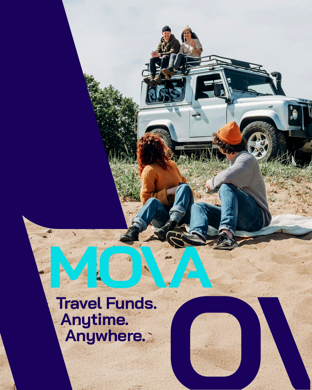 People sitting on a blanket on a beach in front of a light blue off-road vehicle, with some people sitting on the vehicle's roof, enjoying outdoor activity.