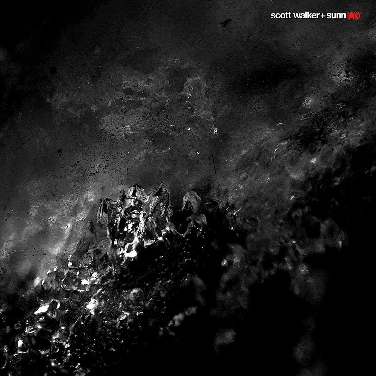 Album covert featuring a close-up of liquid splashing or bubbling on a dark surface with the logo "scott walker + sunn" in the top right corner.