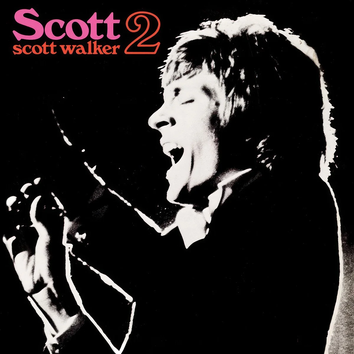 Album cover with black and white portrait of a Scott Walker passionately performing with eyes closed, mouth open, and holding a microphone, with the text 'Scott Scott Walker 2' in pink and red at the top.