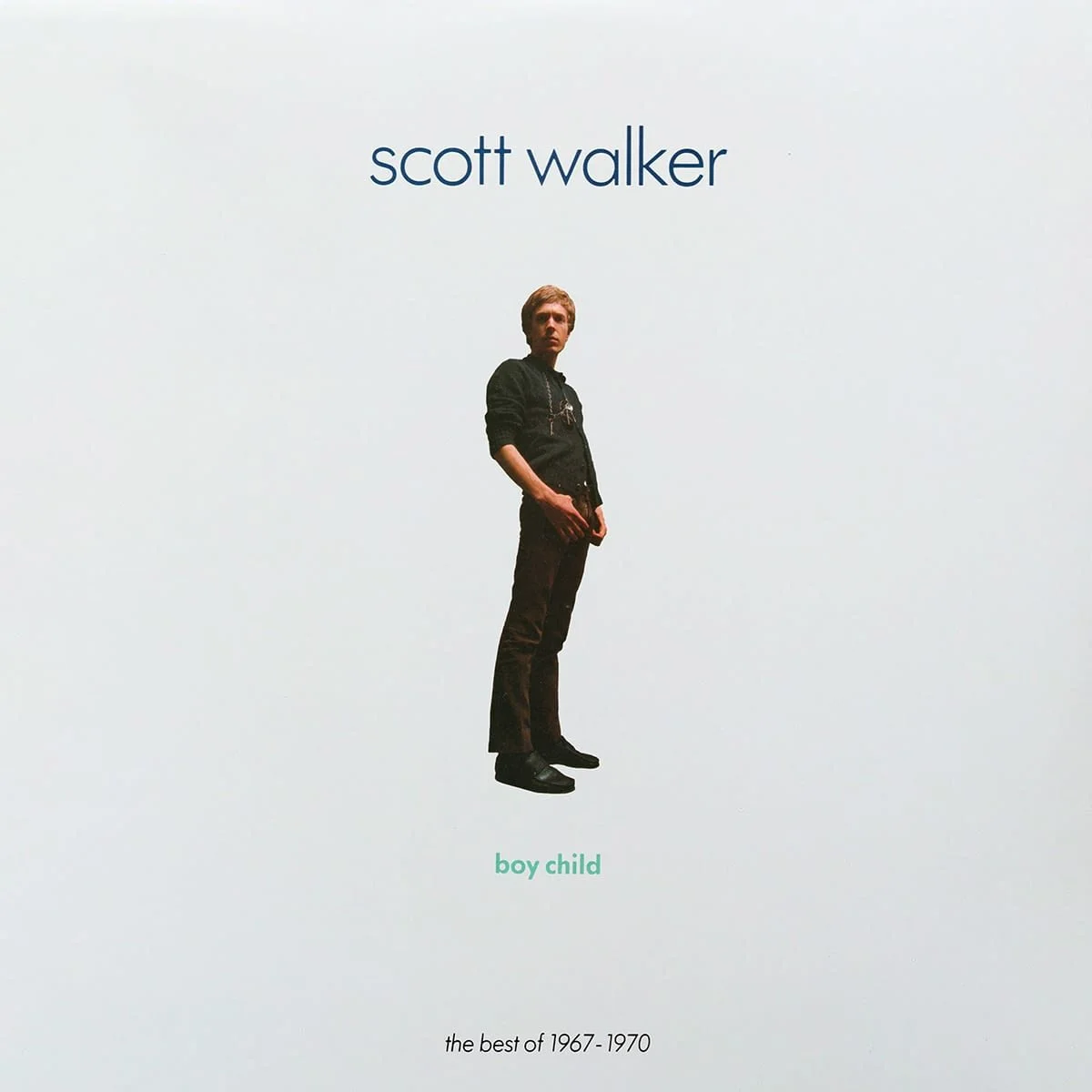 Album cover for Scott Walker's 'Boy Child,' featuring a full-length portrait of Scott in black clothing standing against a plain light background with text above and below.