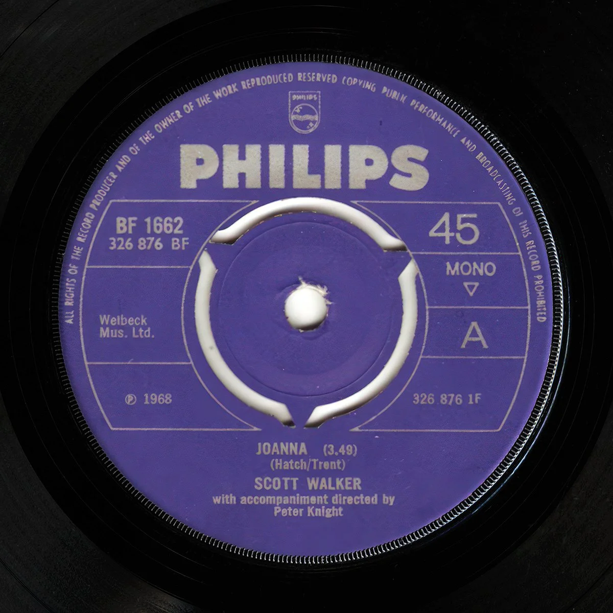 Close-up of a vintage 45 RPM vinyl record with a purple label. The record is titled "Joanna" by Scott Walker, with detailed production and rights information around the label.