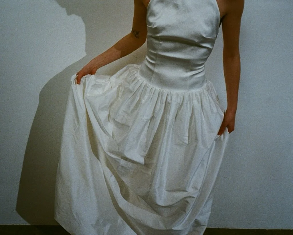 Phaedra details photographed on 35mm film: A scooped low back, 90s inspired duchess satin bodice with a voluminous silk doupion skirt.