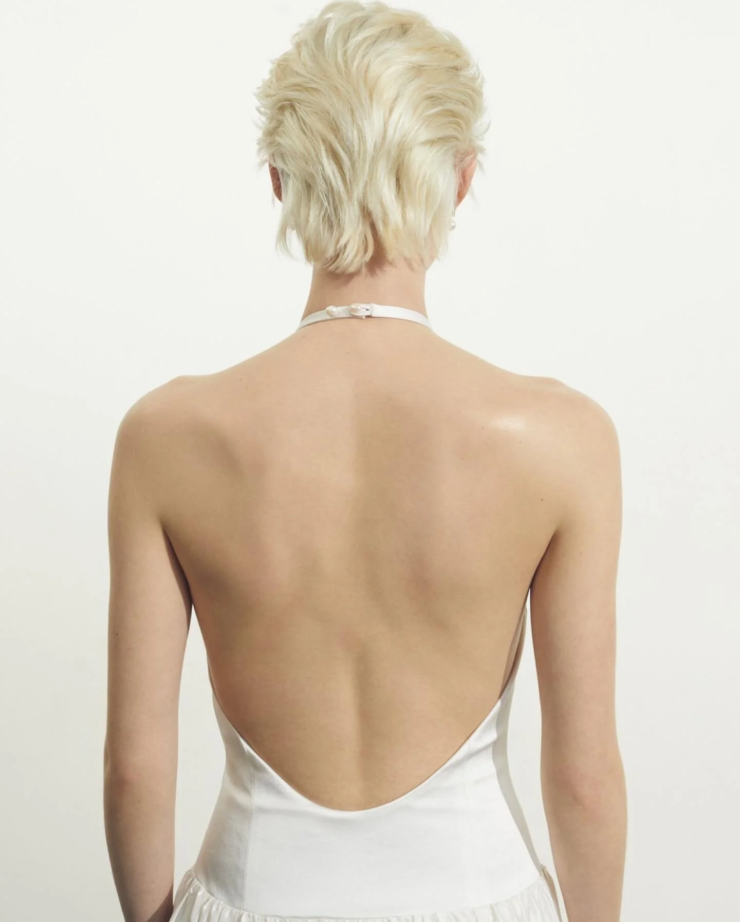 Phaedra back details - inspired by 90s Calvin Klein, features a halter neck bodice in stretch duchess satin with a freshwater pearl clasp 🐚