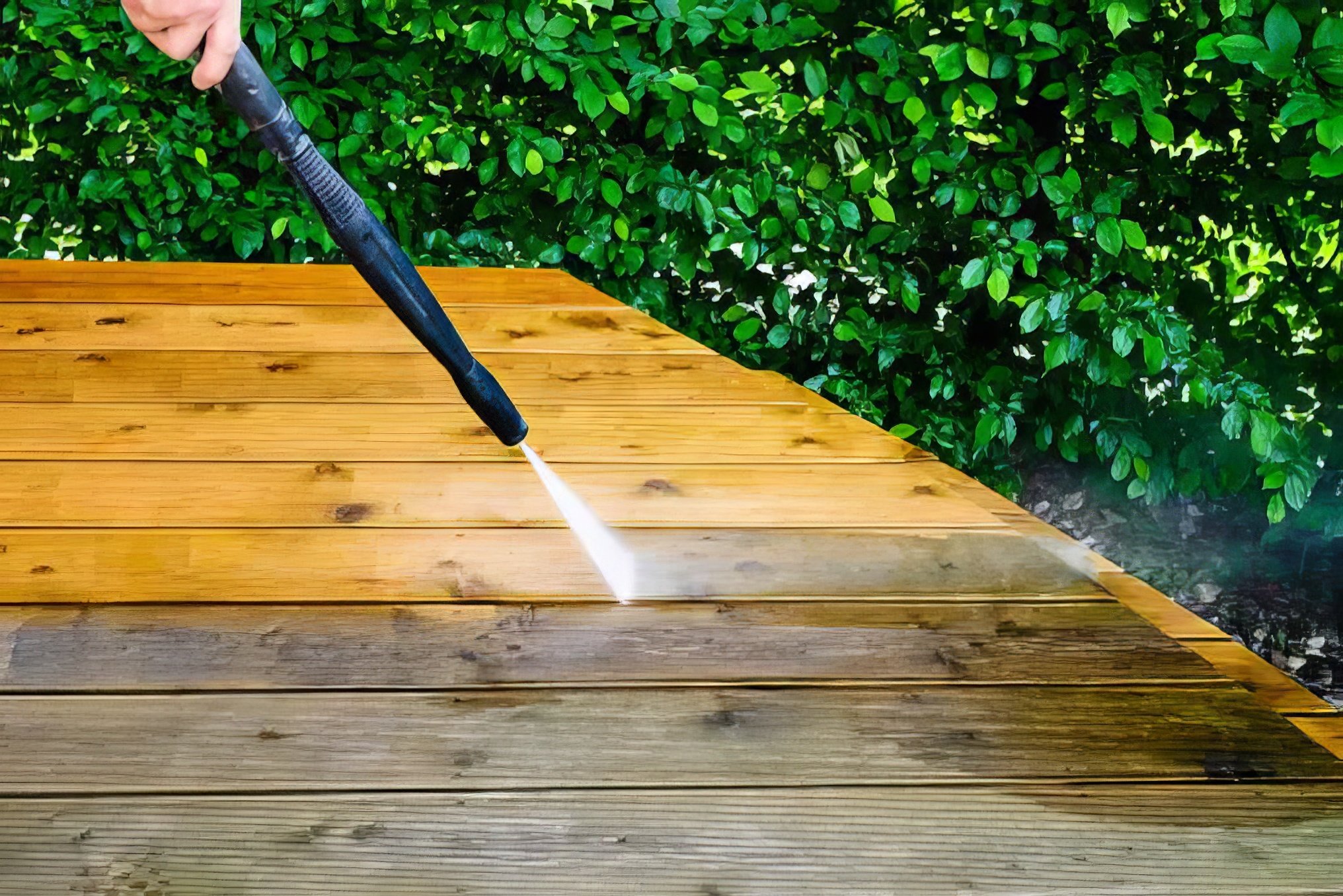 High pressure hose cleaning an outdoor deck. RPM Painting are masters at high pressure cleaning
