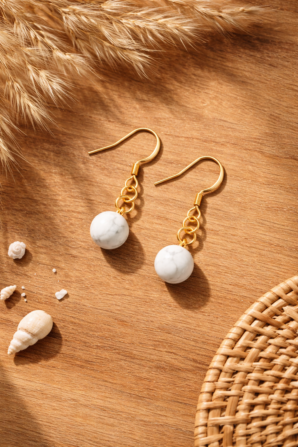 Elegant earrings on wooden surface