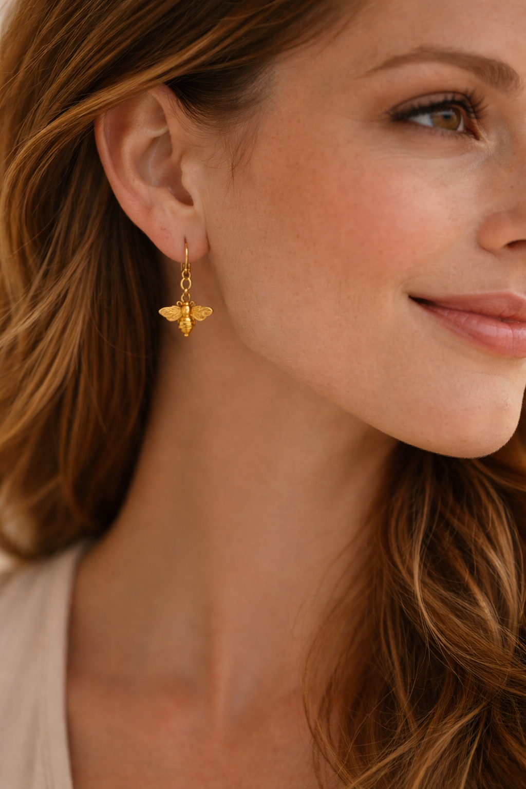 bee earrings on model.png
