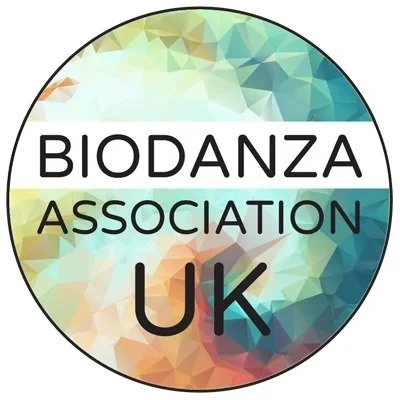 Biodanza Association UK logo with a colorful abstract background and bold text.