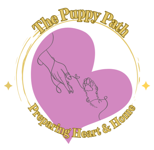 Logo featuring a purple heart with a line drawing of a hand and a puppy, surrounded by gold text reading 'The Puppy Path Preparing Heart & Home'.