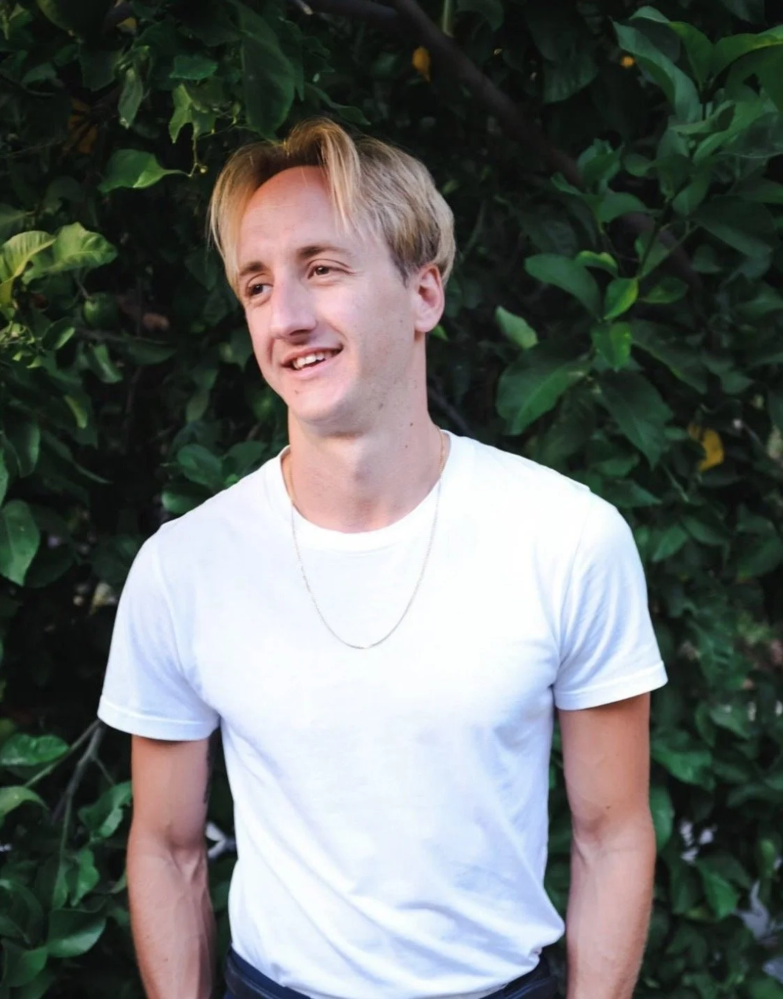 Close-up of a fountain pen writing cursive on lined paper.