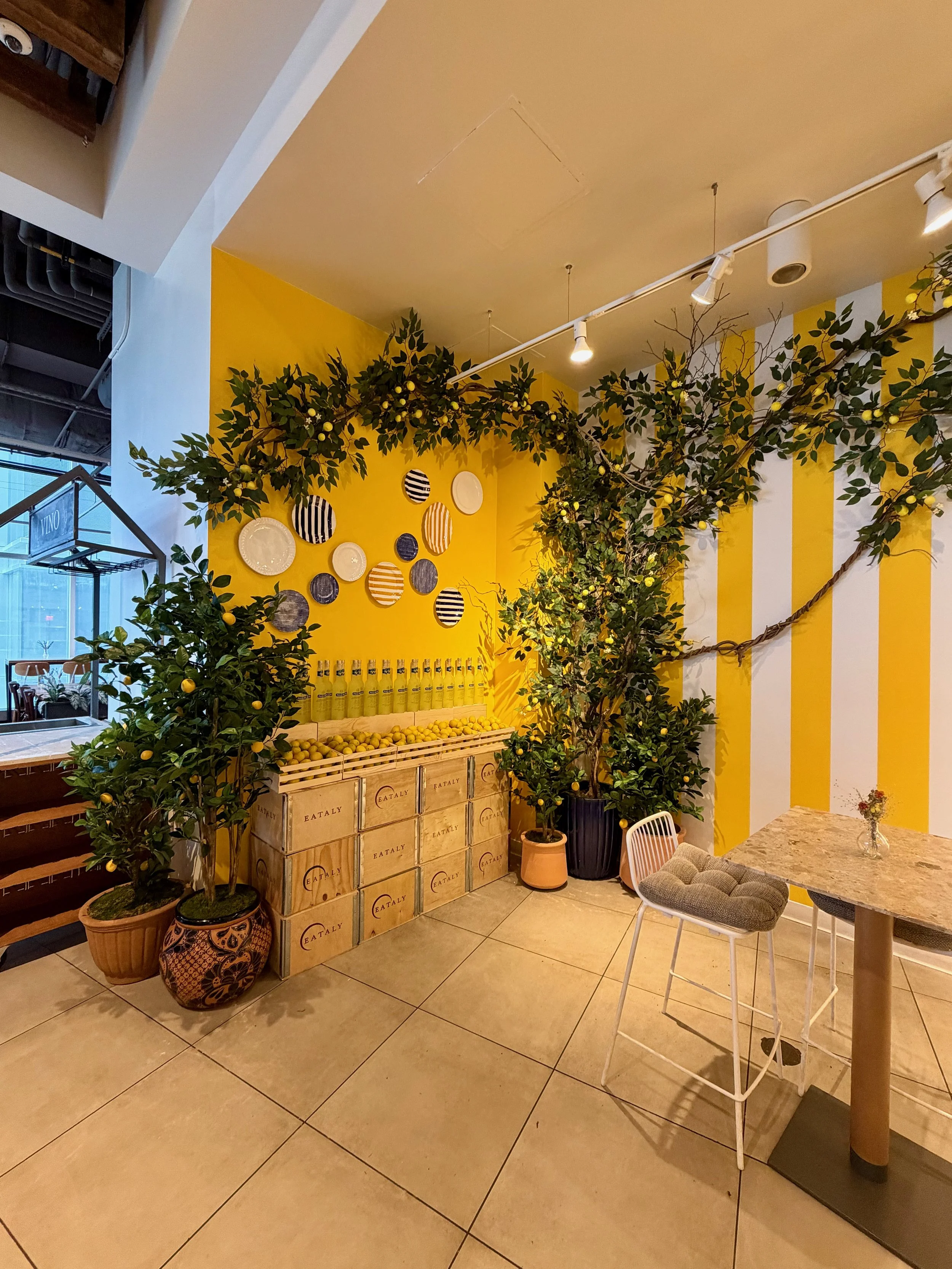 Pallini display, plate wall and decor for Pallini limoncello pop-up at Eataly New York-Downtown